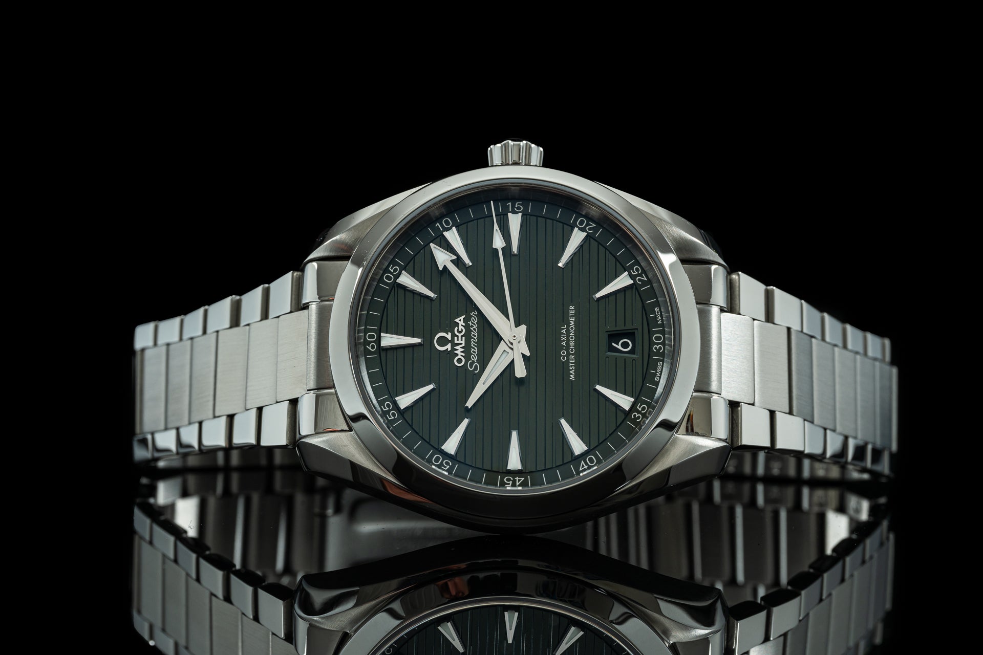 Omega Seamaster stainless steel watch with black dial, white markers, and metal link bracelet on black background