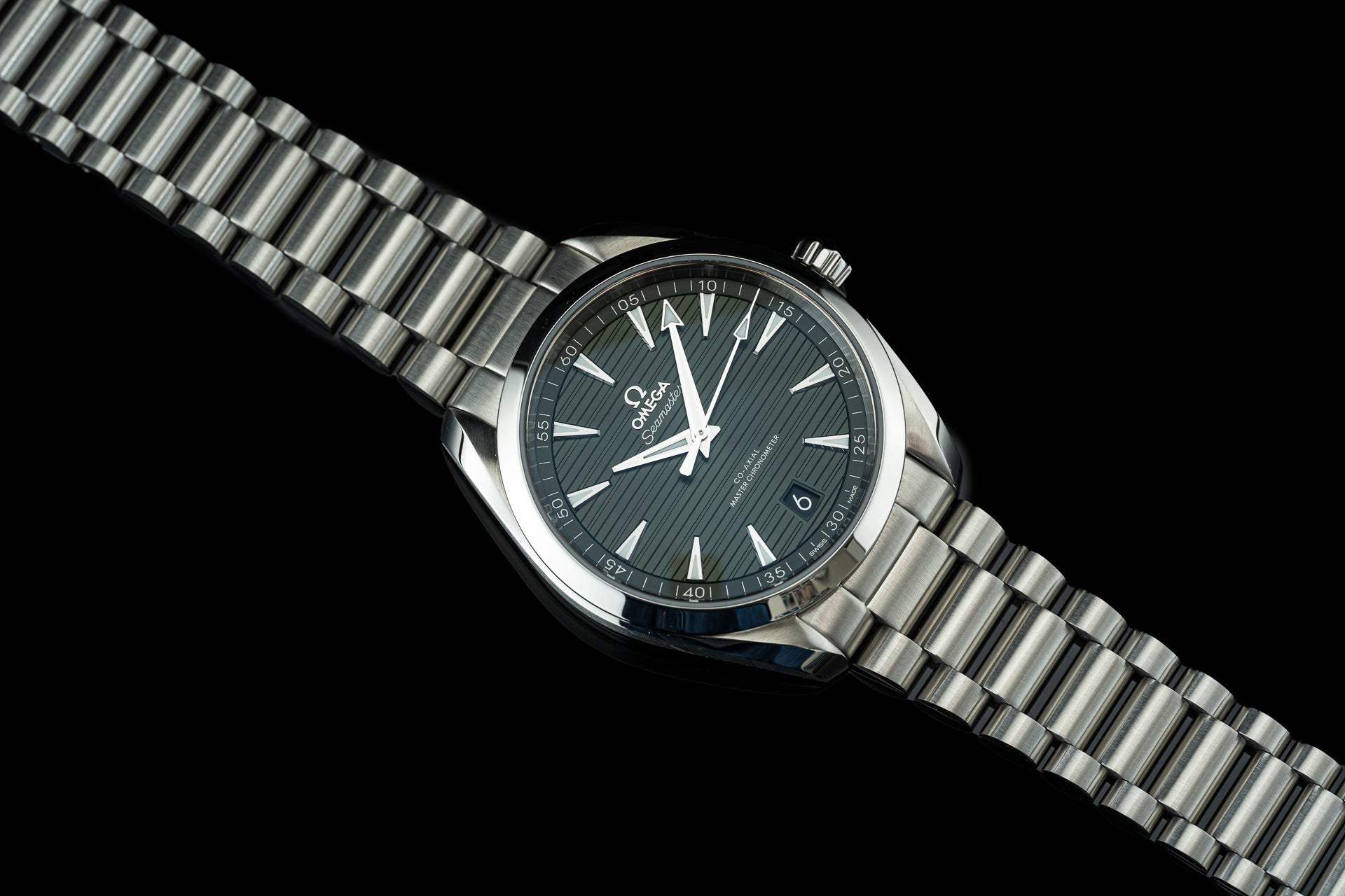 Stainless steel bracelet for Omega Aqua Terra 41mm watch with polished and brushed links on black background