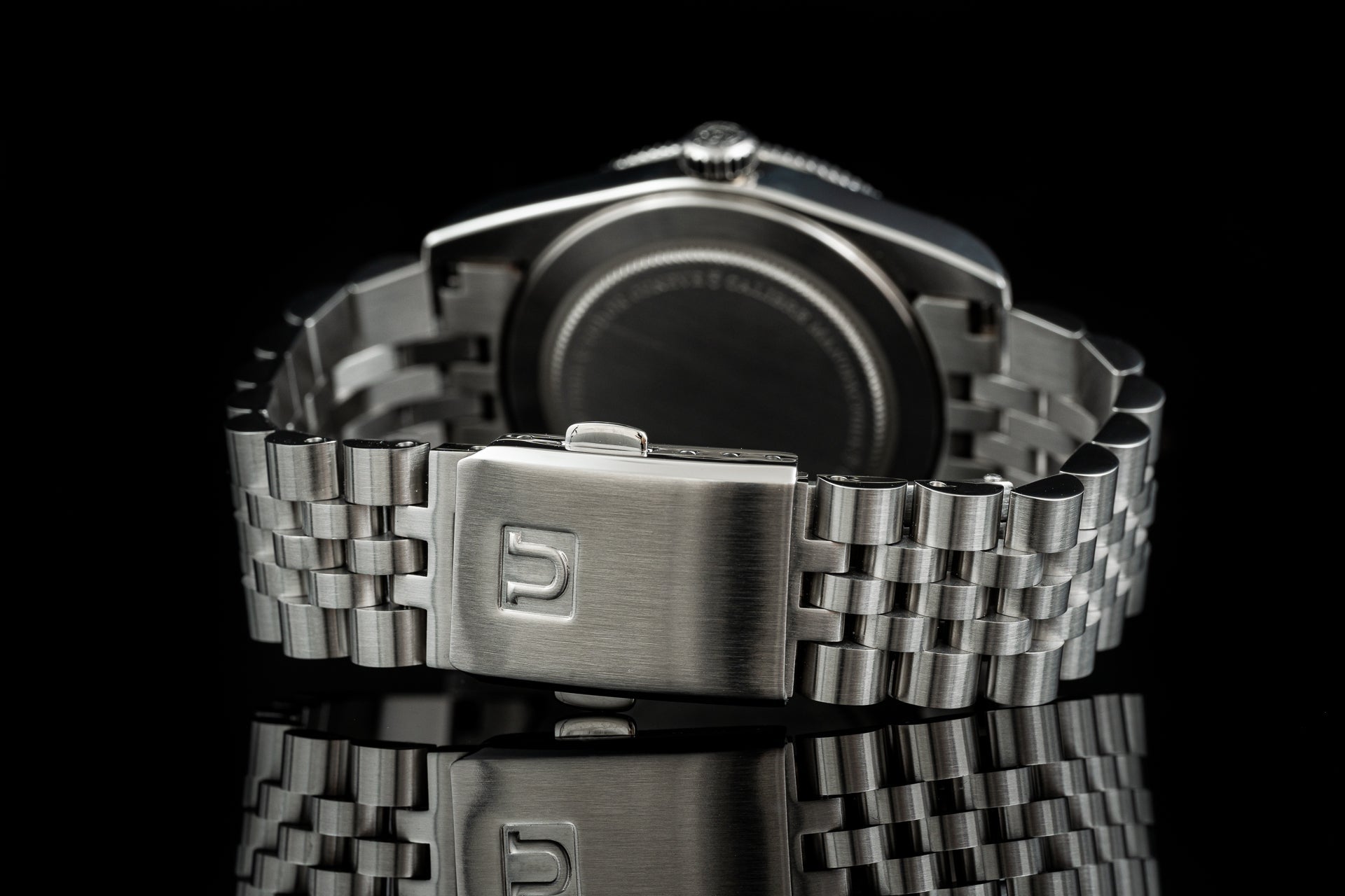 Stainless steel bracelet with deployment clasp for Tudor Black Bay 54 watch, shown front view against black background