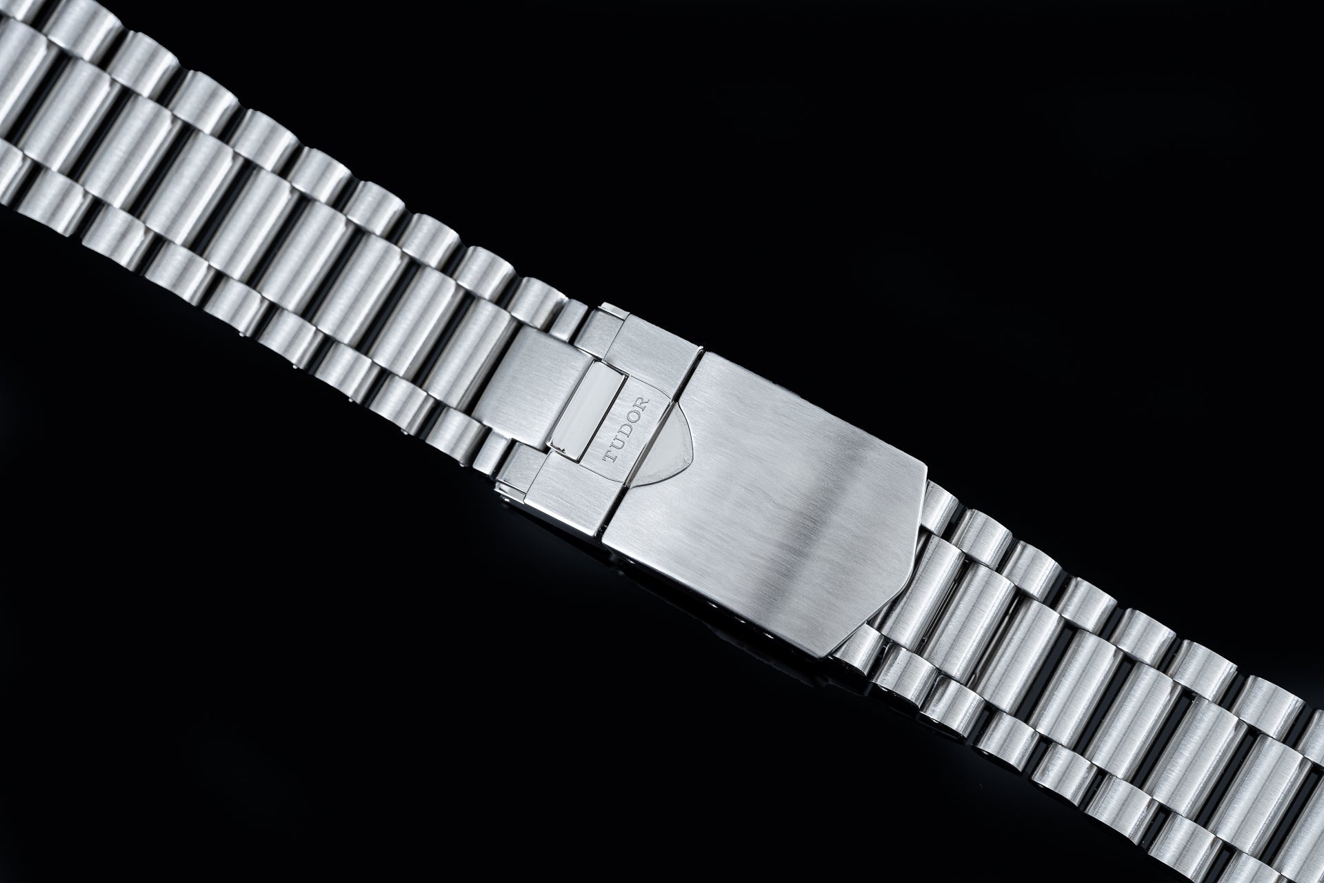 Stainless steel watch bracelet with cylindrical links and branded clasp for Tudor Black Bay 41mm models