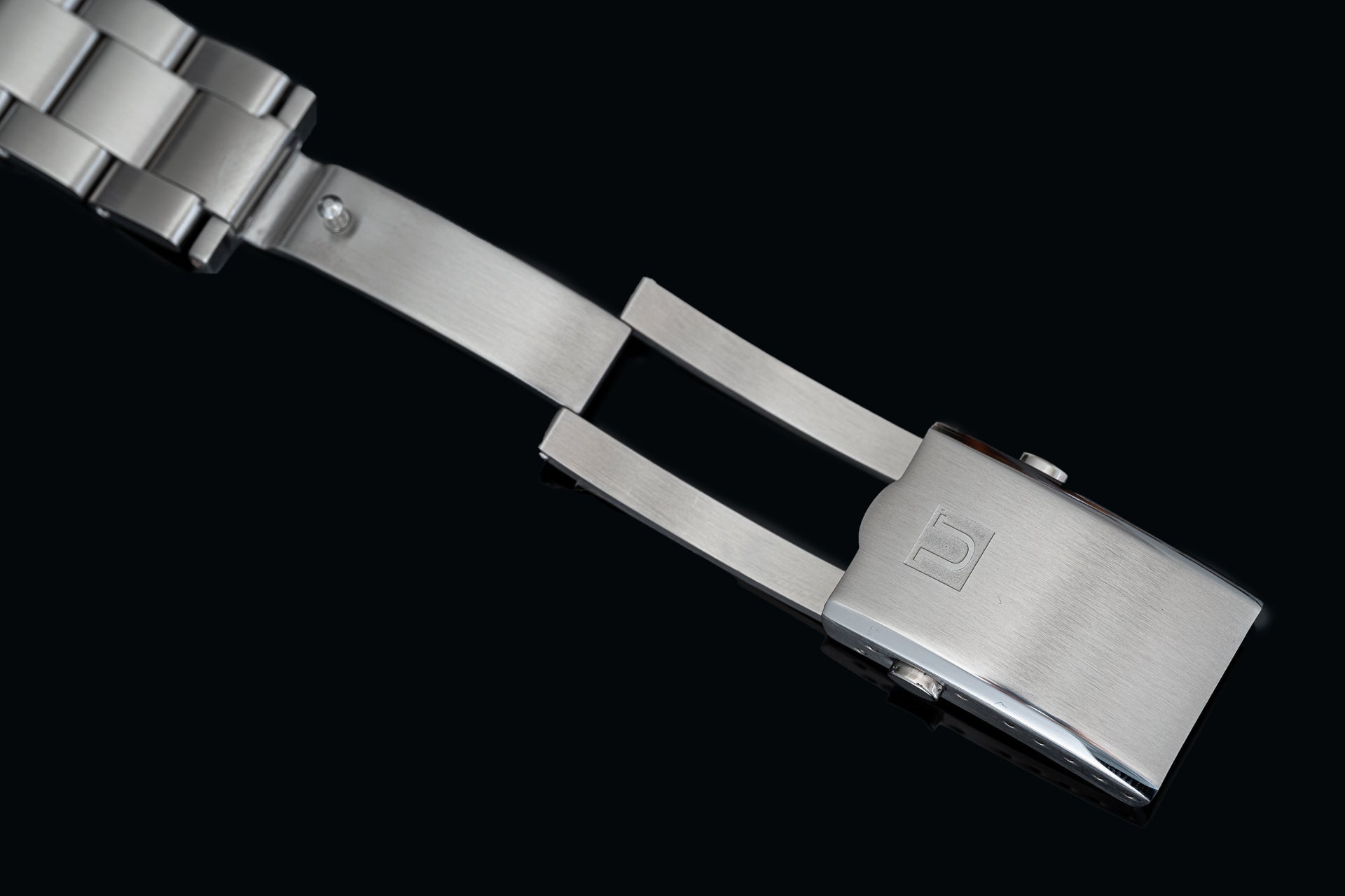 Stainless steel bracelet end link and clasp for Tudor 41mm watches, showing brushed metal finish and secure closure mechanism