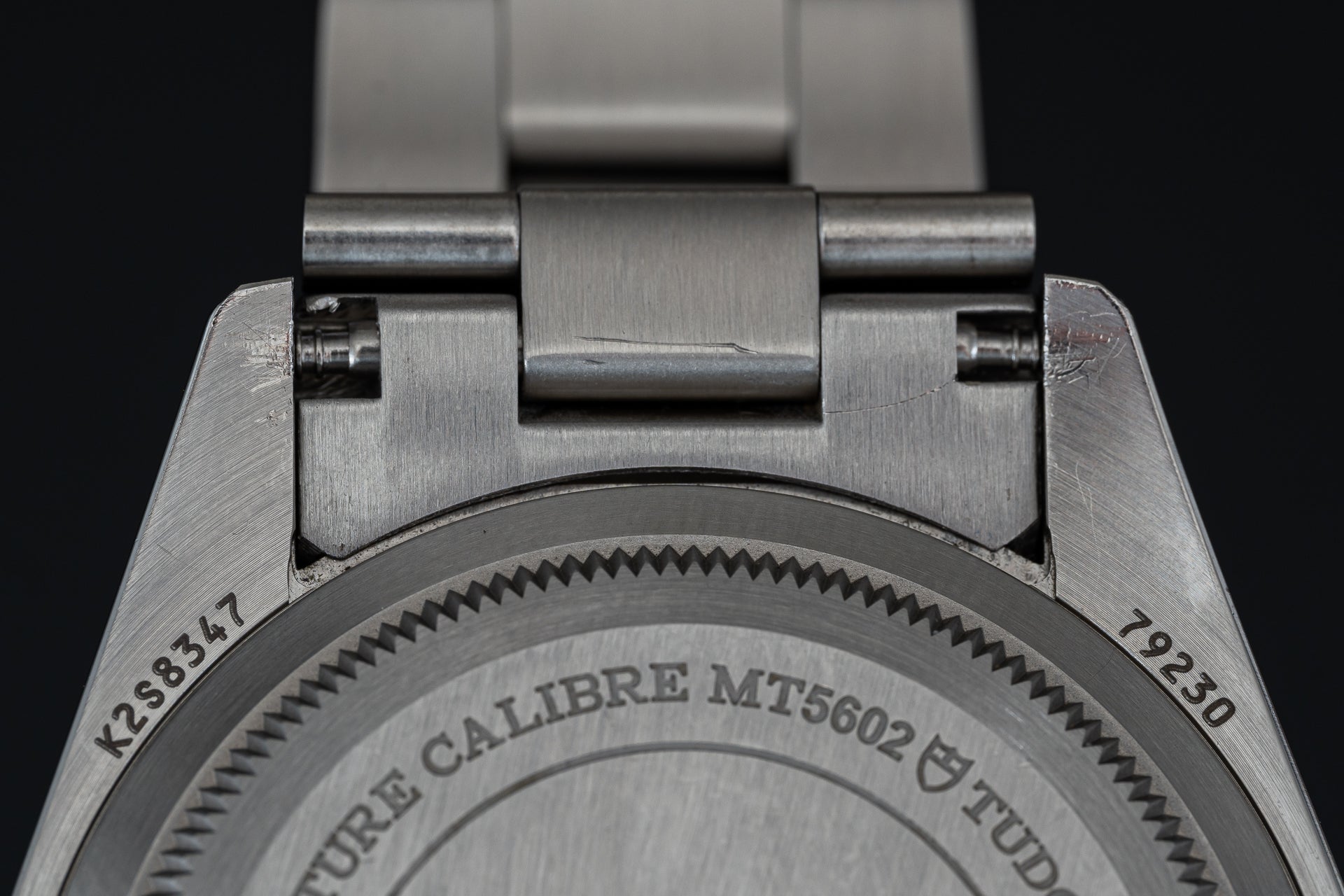 Stainless steel watch bracelet end link for Tudor 41mm models, showing Calibre MT5602 engraving and solid metal construction