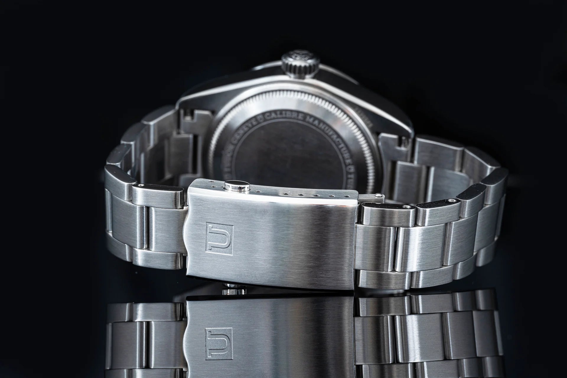 Stainless steel bracelet with folding clasp for Tudor Black Bay 58 GMT watch displayed against black background