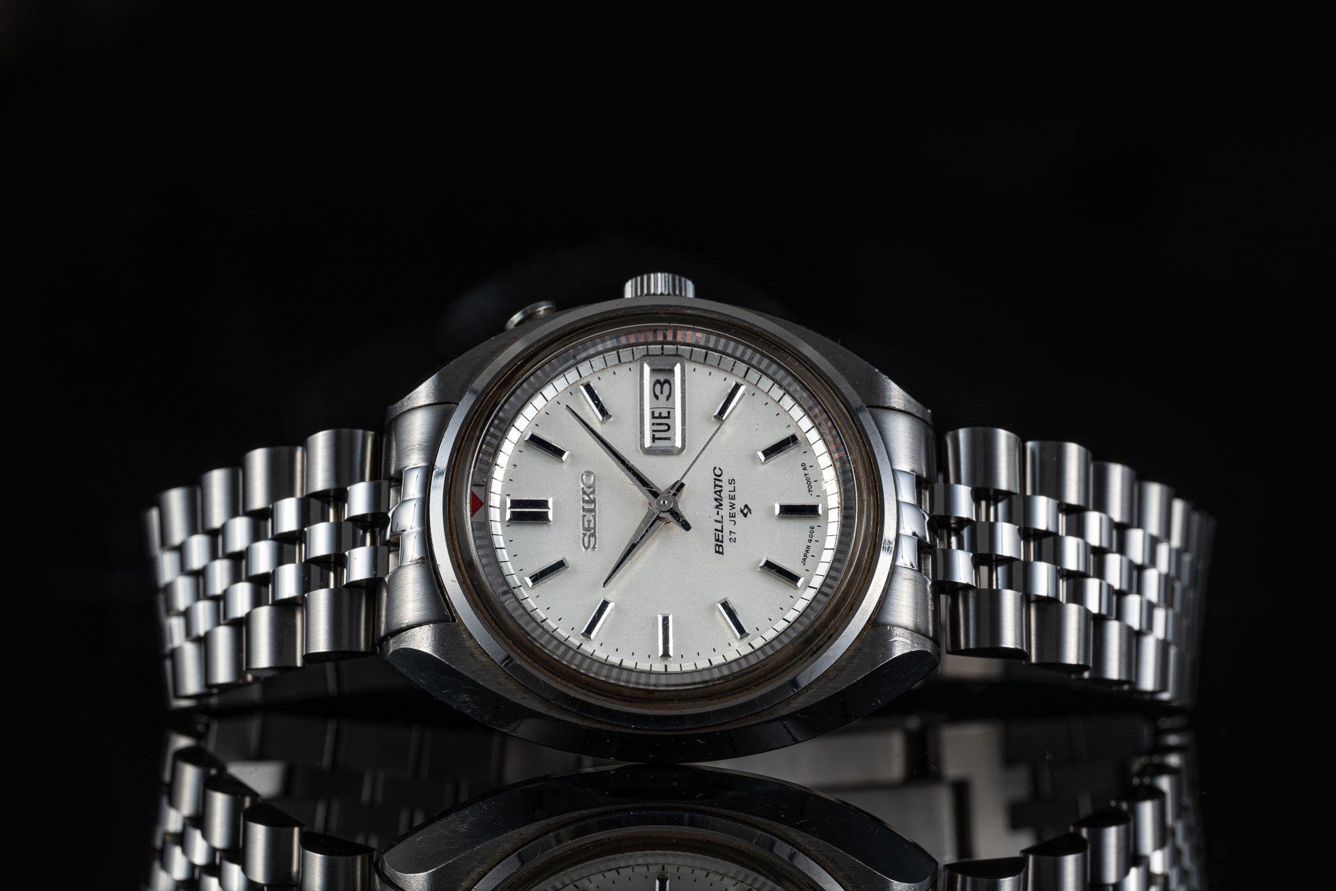 Seiko Bell-Matic 4006-7000 automatic watch with silver dial, day-date window, stainless steel bracelet on black background