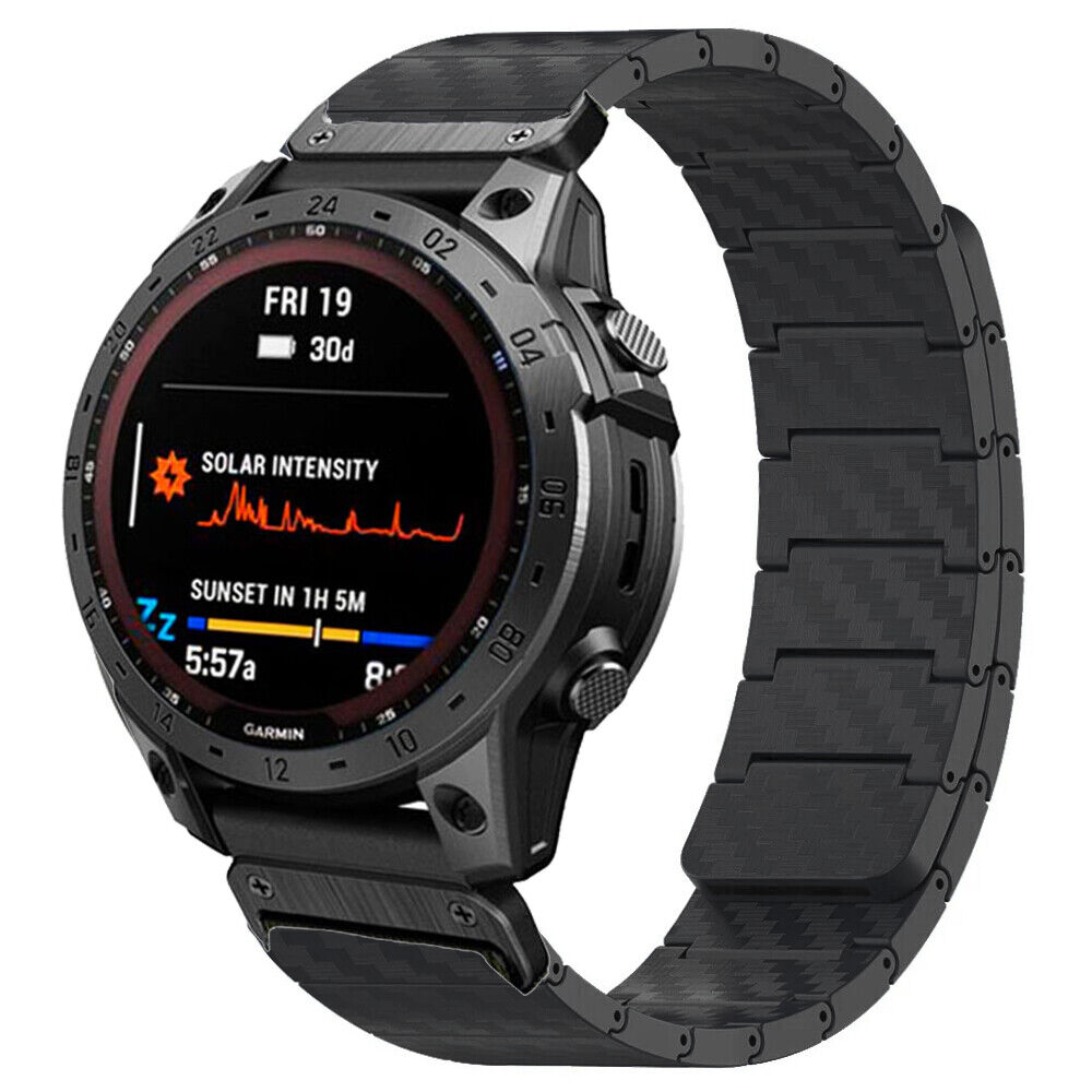 Garmin smartwatch with black metal band displaying solar intensity and sunset time on AMOLED screen
