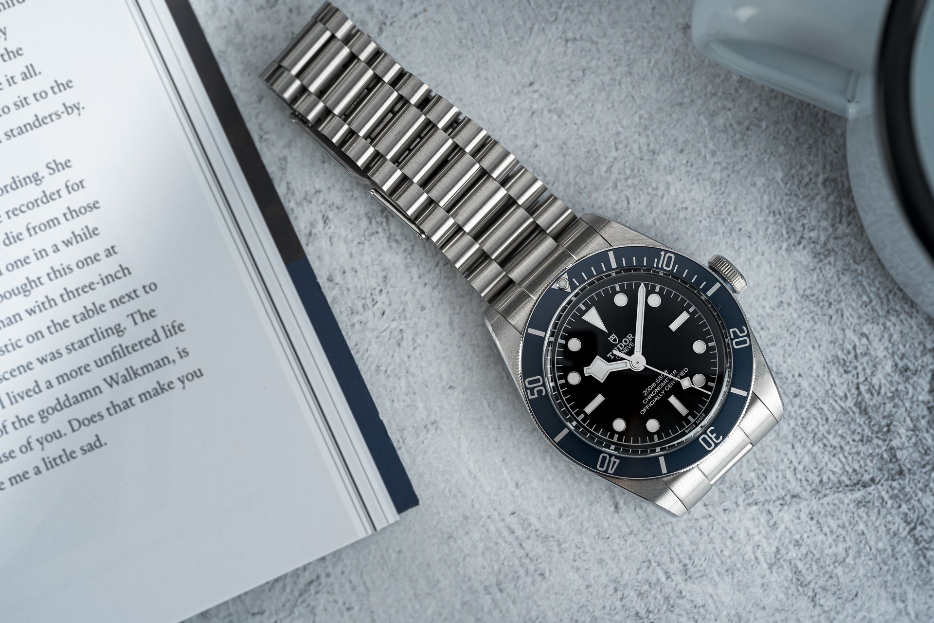 Stainless steel metal bracelet for Tudor Black Bay 41mm watch with solid end links and polished finish on gray surface