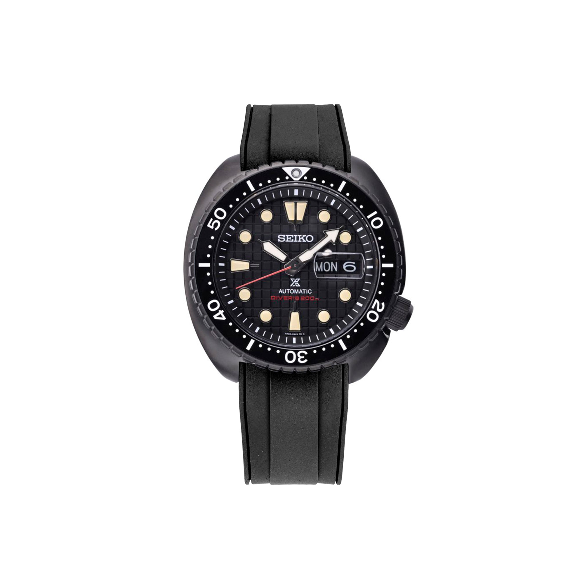 Seiko Prospex automatic diver watch with black dial, luminous markers, day-date window, and black rubber strap