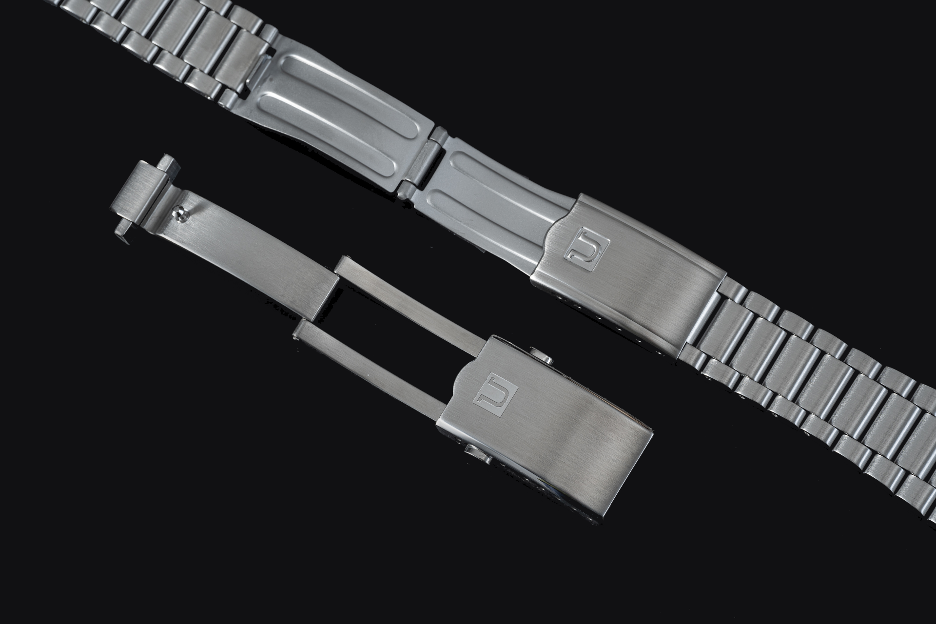 Stainless steel watch bracelet with solid end links and brushed finish clasp for Omega Speedmaster Mark II