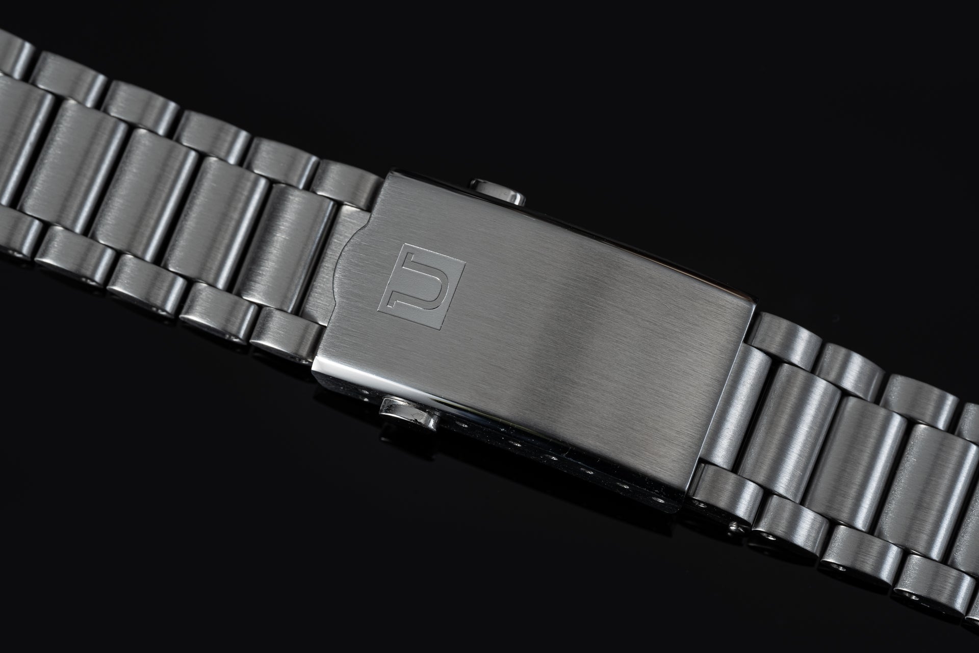 Stainless steel watch bracelet with solid link design and brushed finish buckle clasp for Omega Speedmaster Mark II