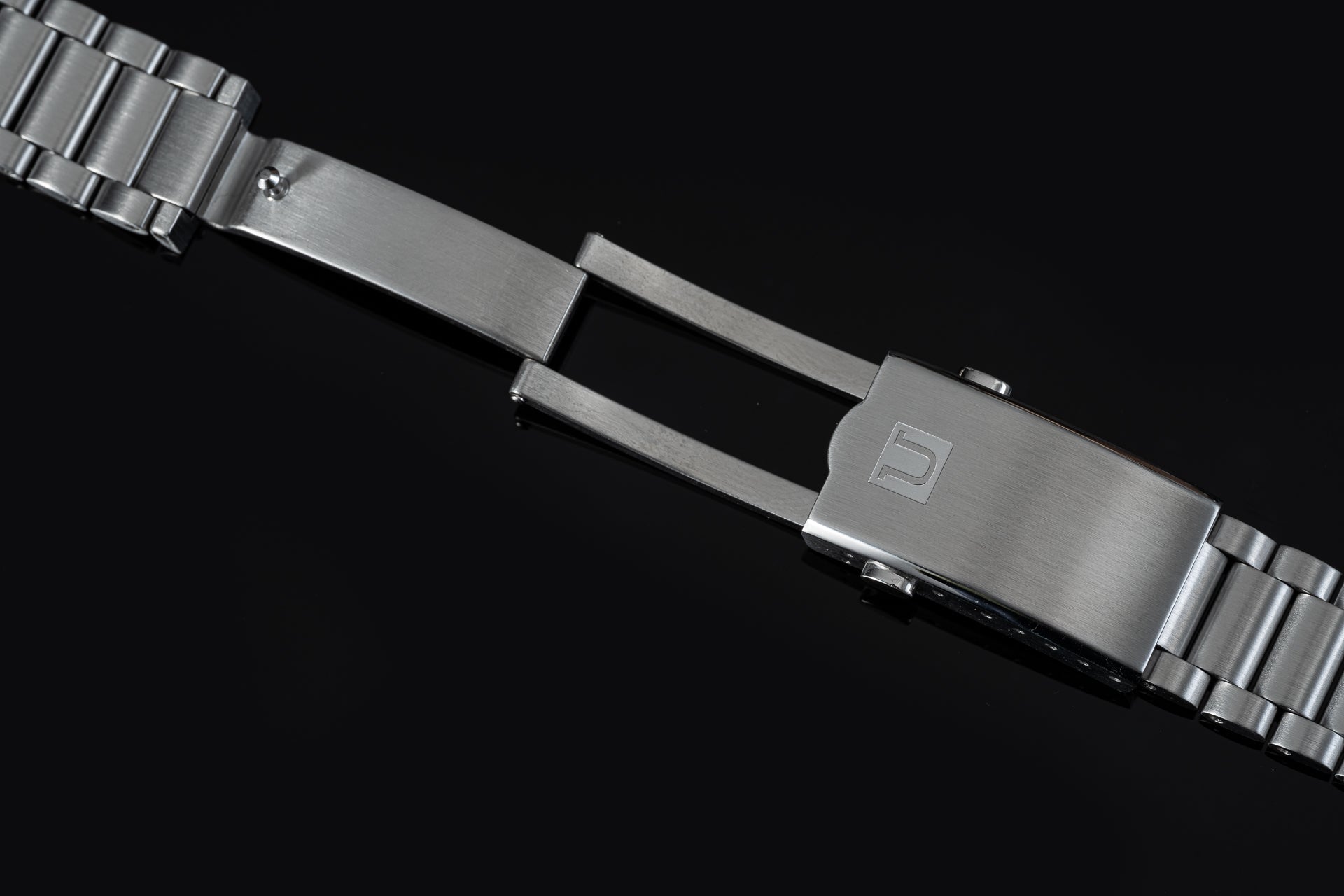 Stainless steel watch bracelet with solid end links and adjustable clasp for Omega Speedmaster Mark II timepiece