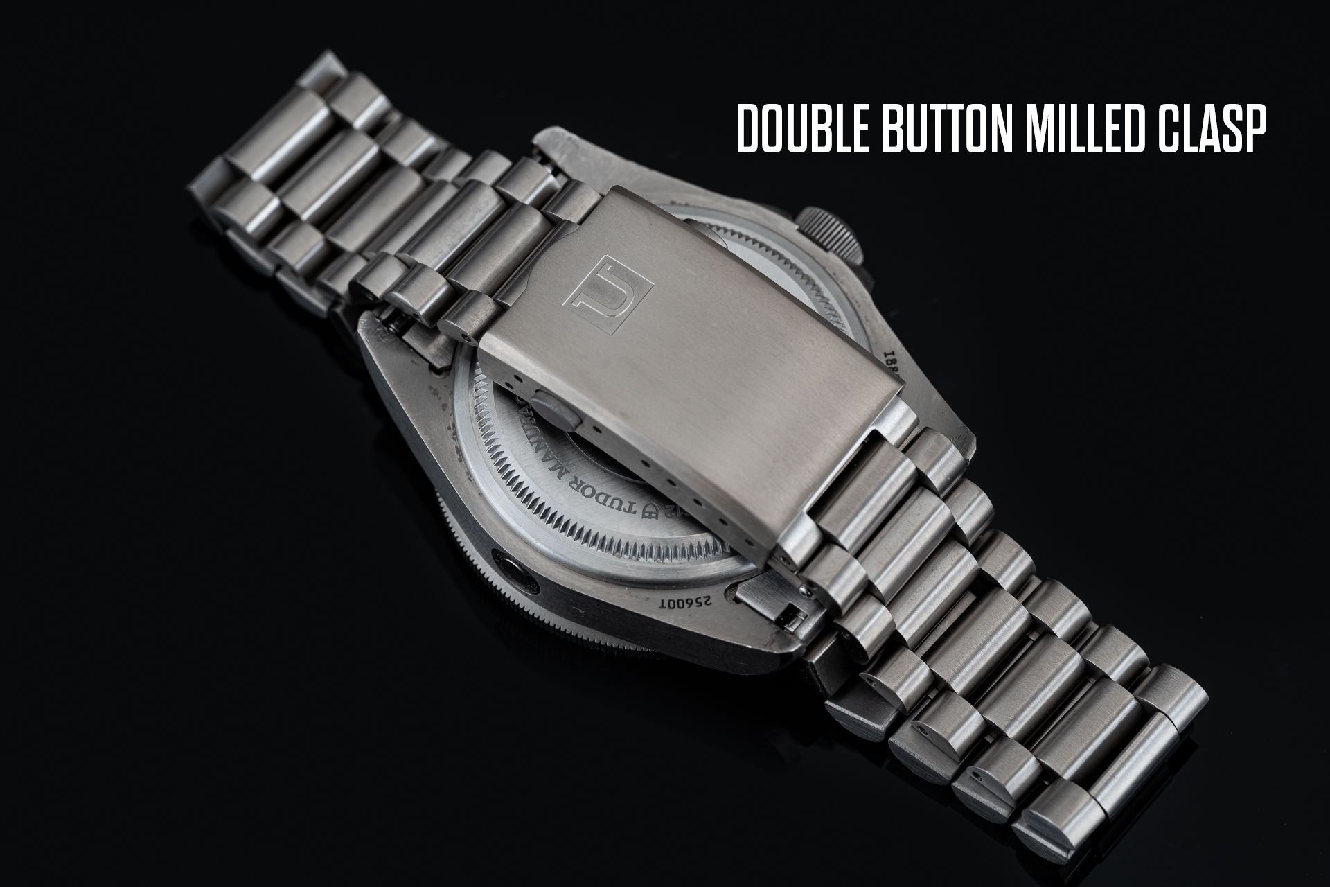 Titanium bracelet with double button milled clasp for Tudor Pelagos 42mm watch, featuring solid link construction and secure fastening mechanism