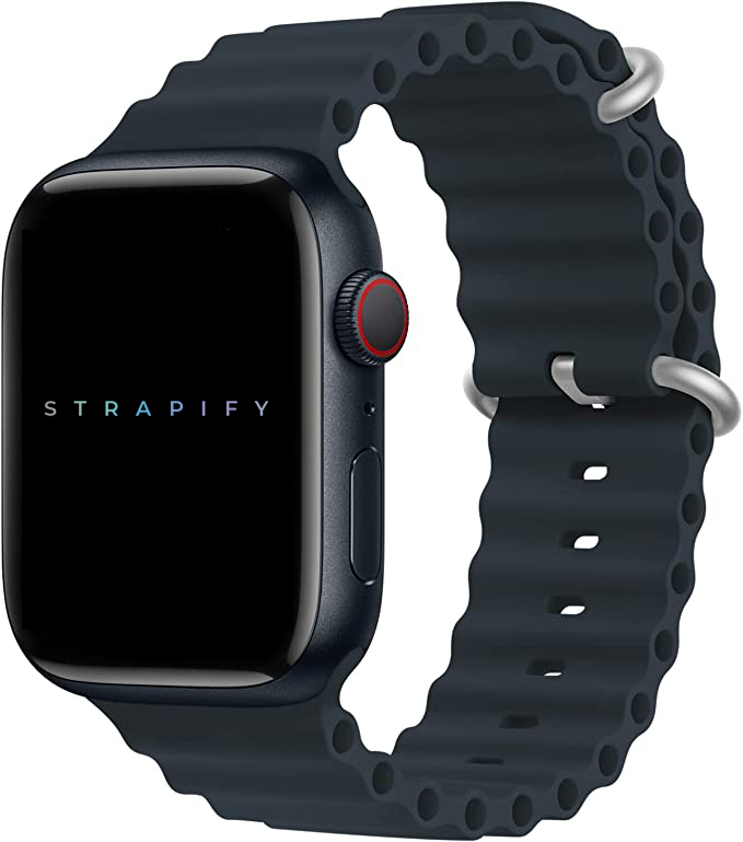 Black silicone ocean loop apple watch band with silver hardware and adjustment holes on sport smartwatch