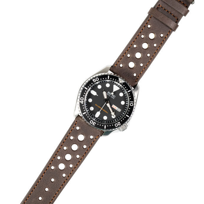 Stainless steel dive watch with black dial and perforated dark brown leather quick release strap