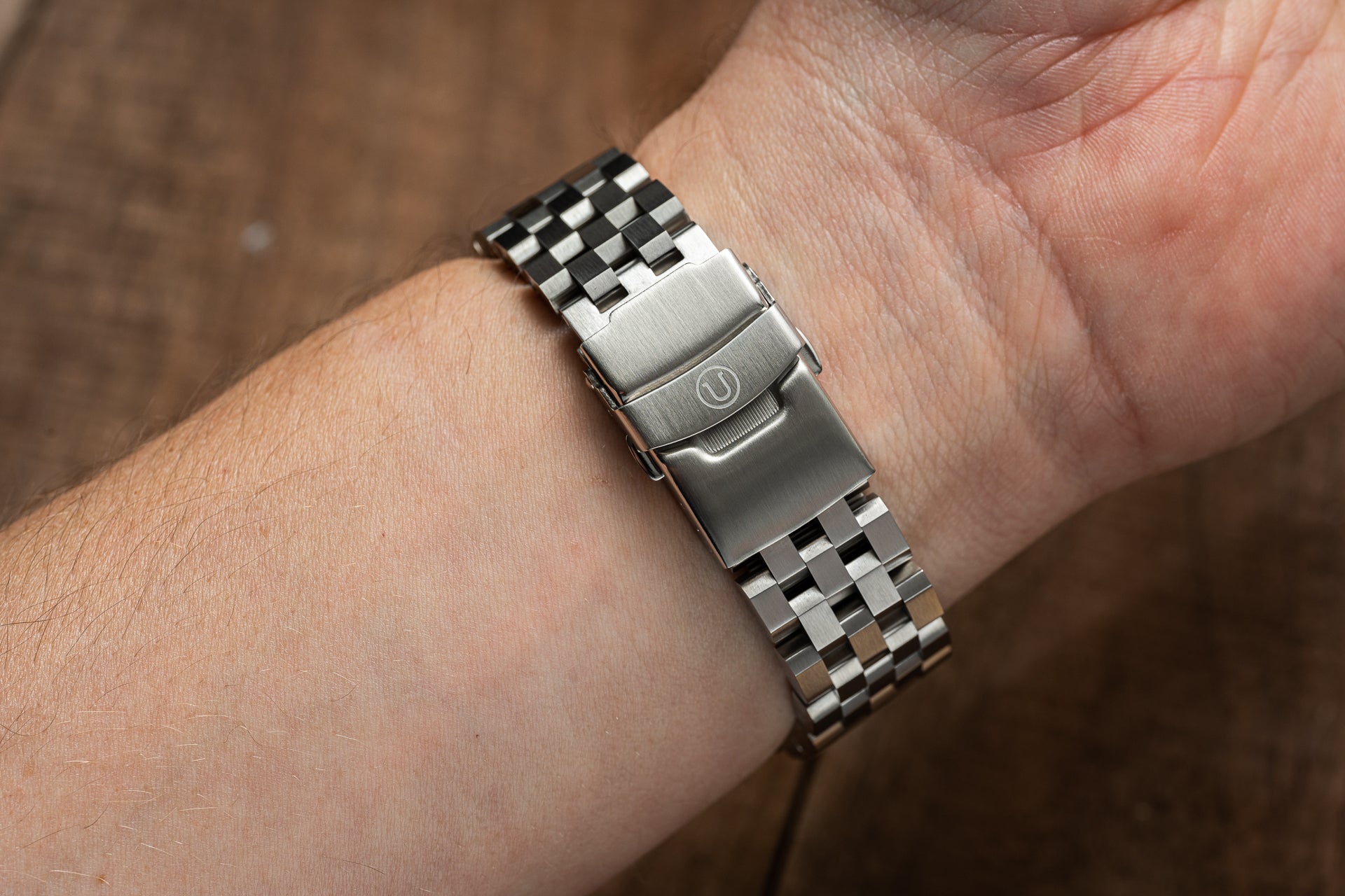 Stainless steel Super Engineer bracelet with solid end links on Seiko Samurai watch, displayed on wrist