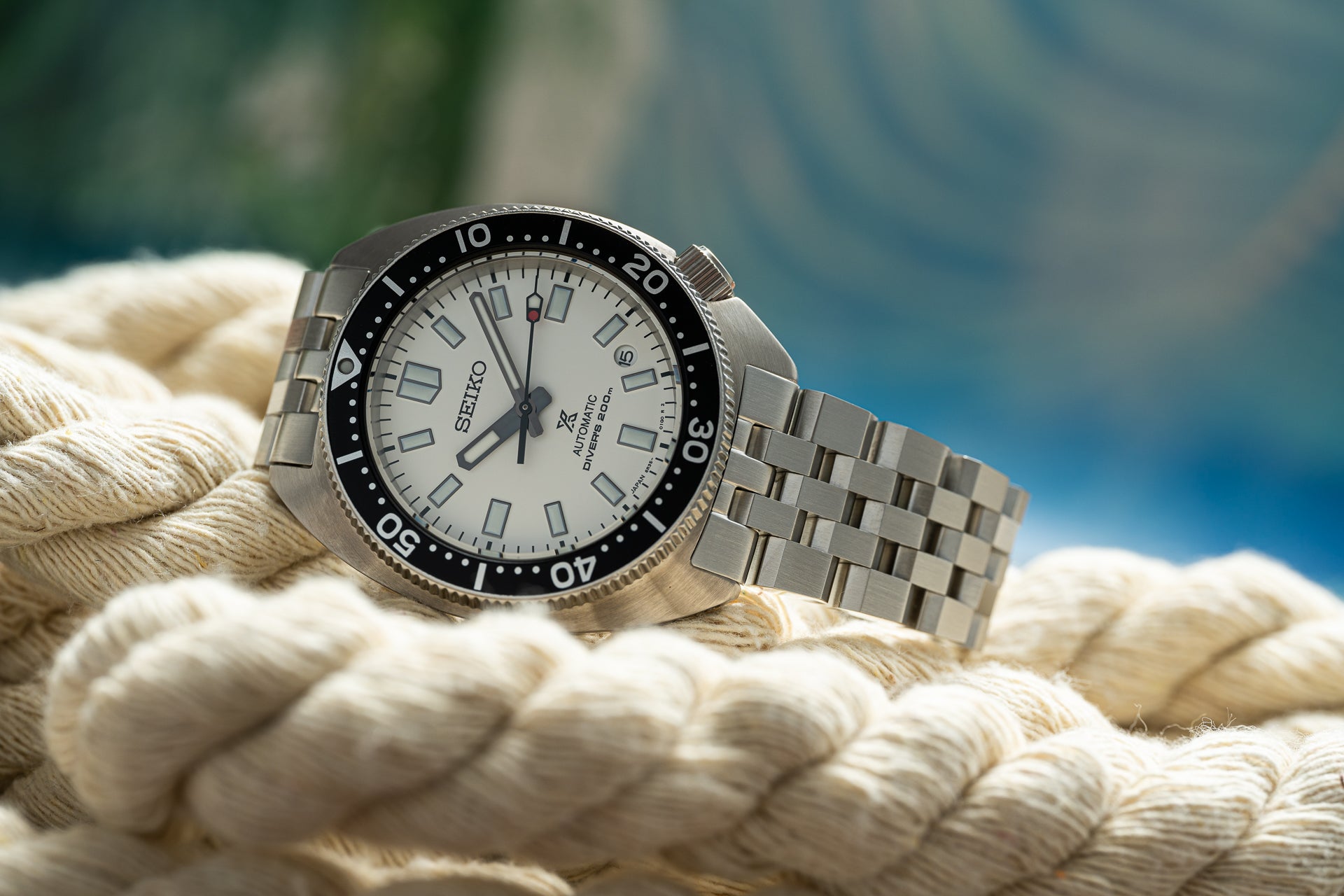 Seiko SPB317 Slim Turtle automatic dive watch with white dial and stainless steel bracelet on nautical rope