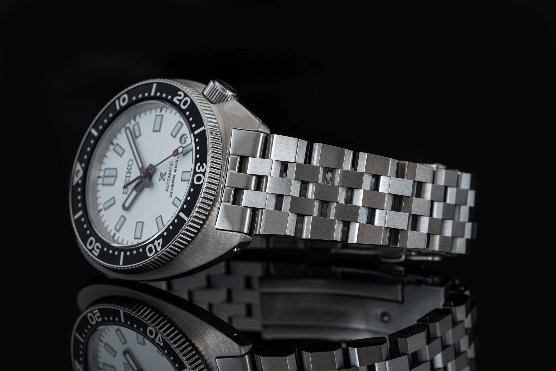 Seiko SPB317 Slim Turtle automatic diving watch with white dial, black bezel, and stainless steel bracelet
