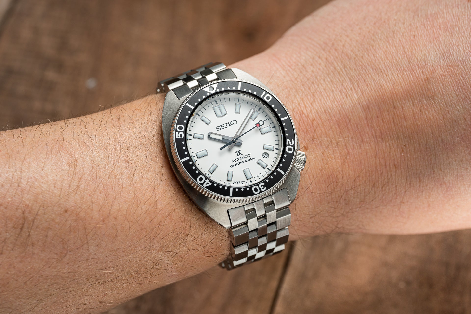 Seiko Prospex Super Engineer automatic dive watch with white dial and stainless steel bracelet worn on wrist