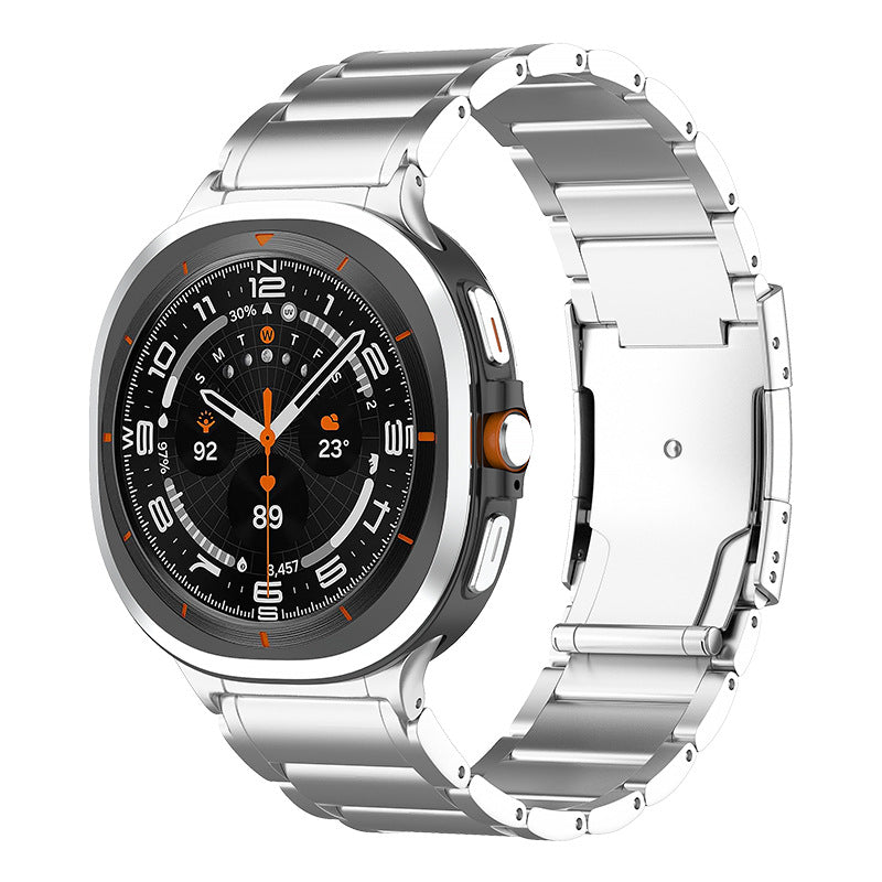 Titanium smartwatch with black dial, orange accents, and stainless steel link bracelet featuring digital compass and multiple complications