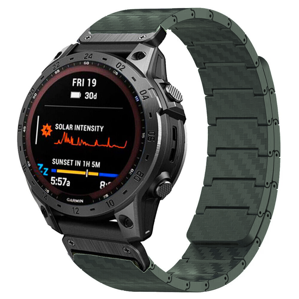 Garmin tactical smartwatch with olive green magnetic carbon fiber quick-fit band displaying solar intensity and sunset data
