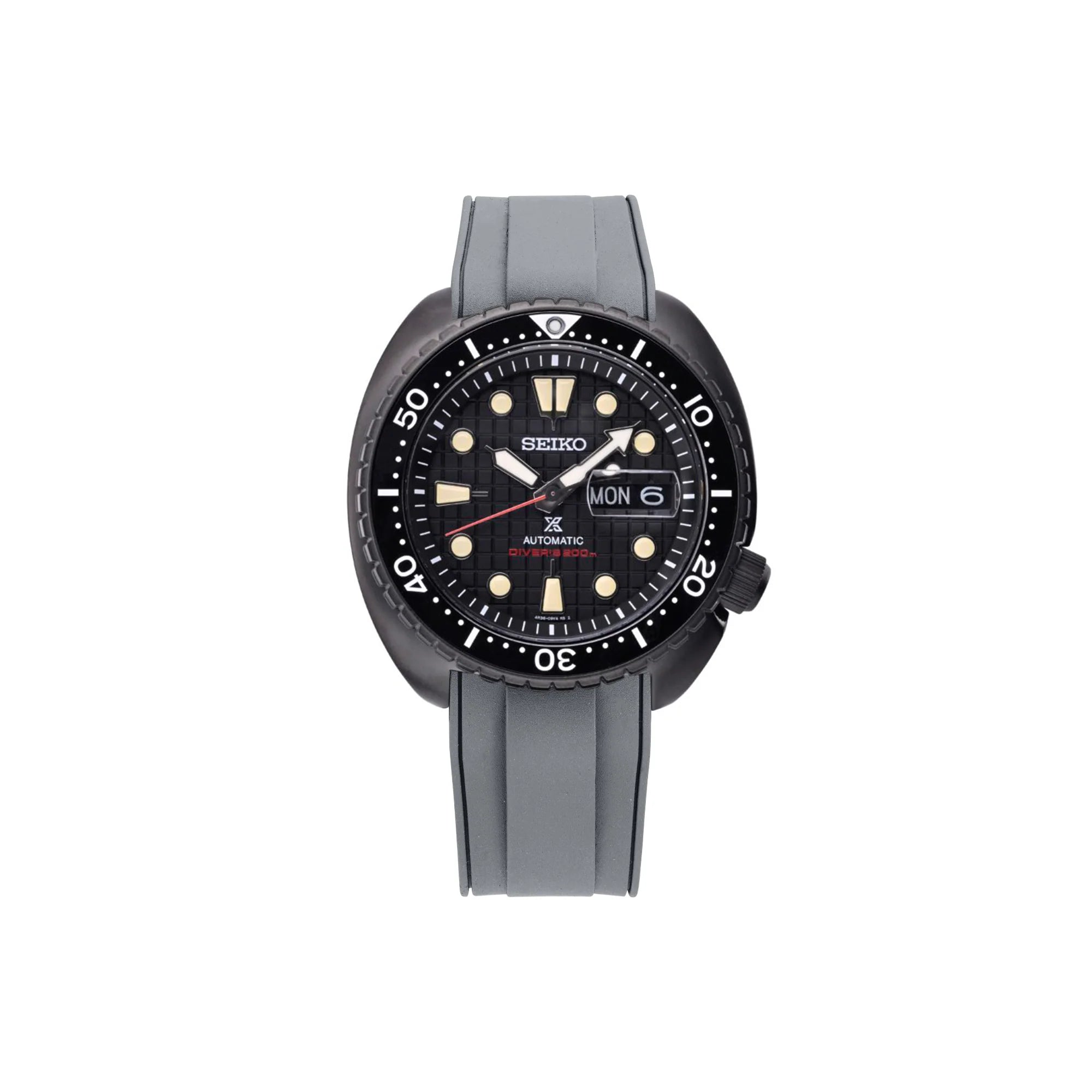 Seiko Prospex Turtle automatic dive watch with black dial, luminous markers, day-date window, and gray rubber strap