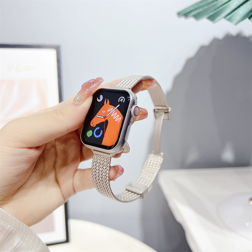 Silver herringbone mesh bracelet for Apple Watch with woven metal band displayed on smartwatch in hand