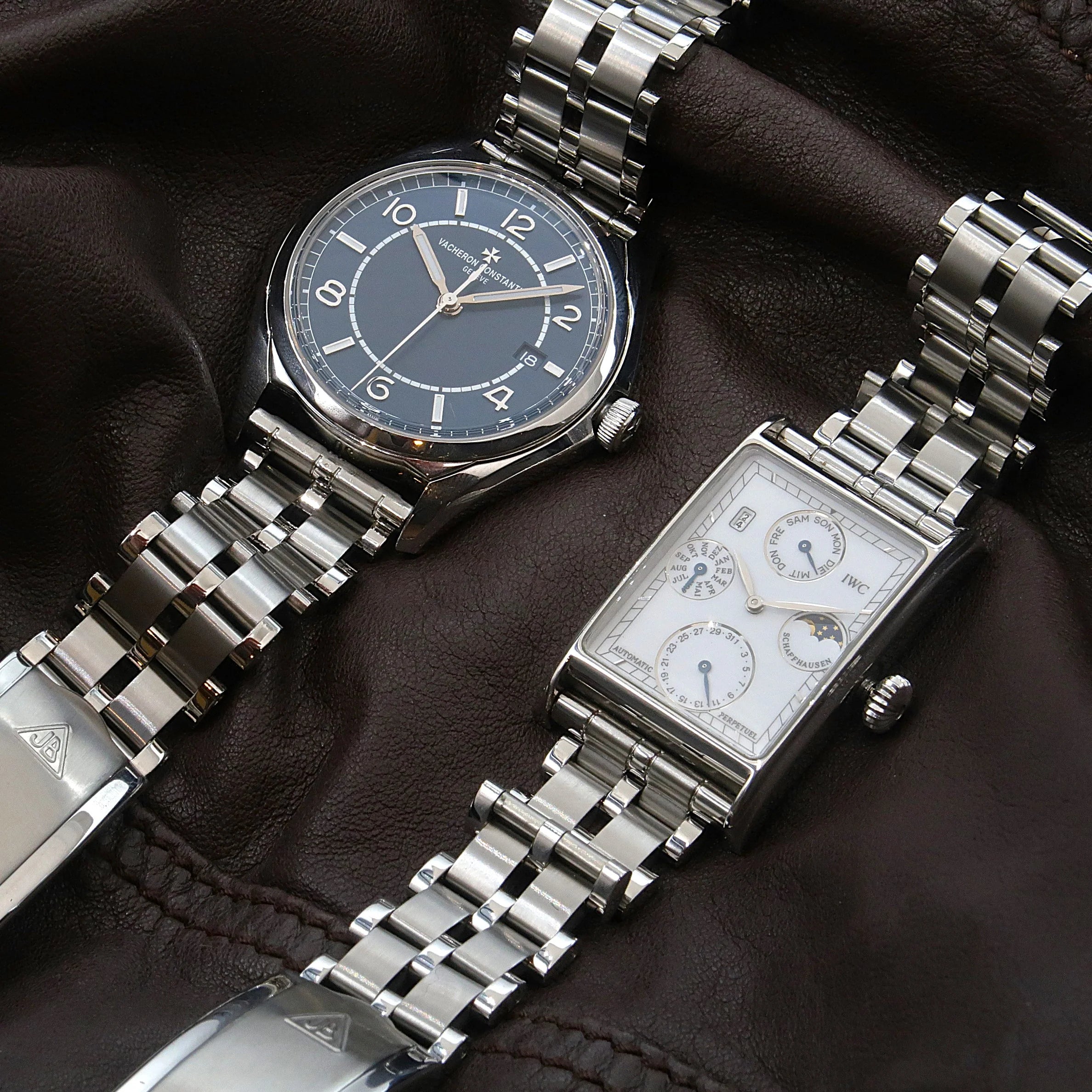 Luxury stainless steel watches with five-row beads of rice bracelet displayed on dark leather background