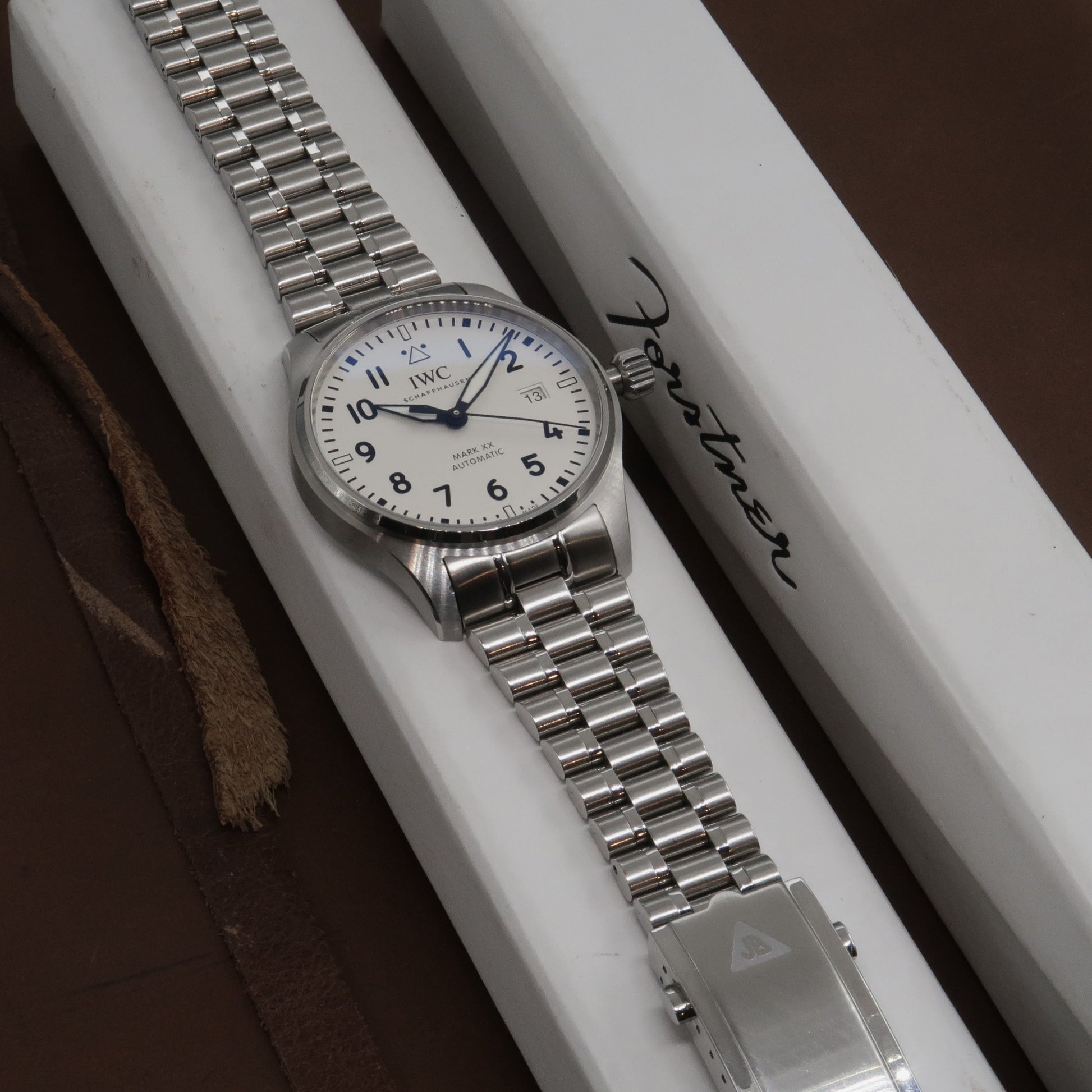 IWC Mark XX automatic watch with steel bracelet on white display box with branded packaging