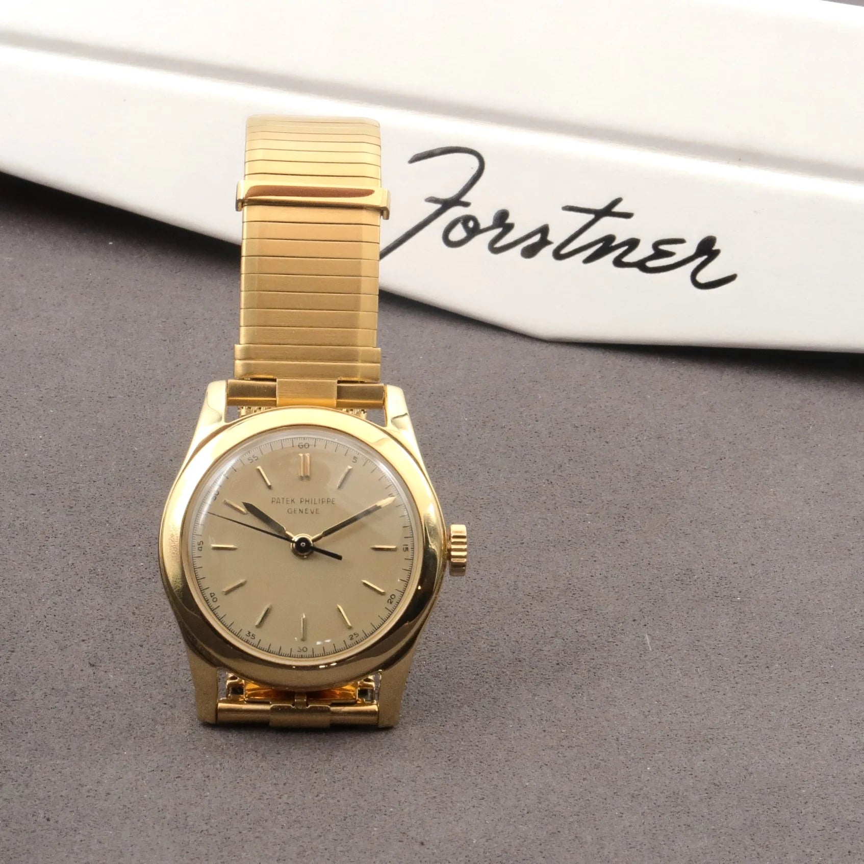 Gold plated vintage Patek Philippe Geneve dress watch with champagne dial and expandable bracelet