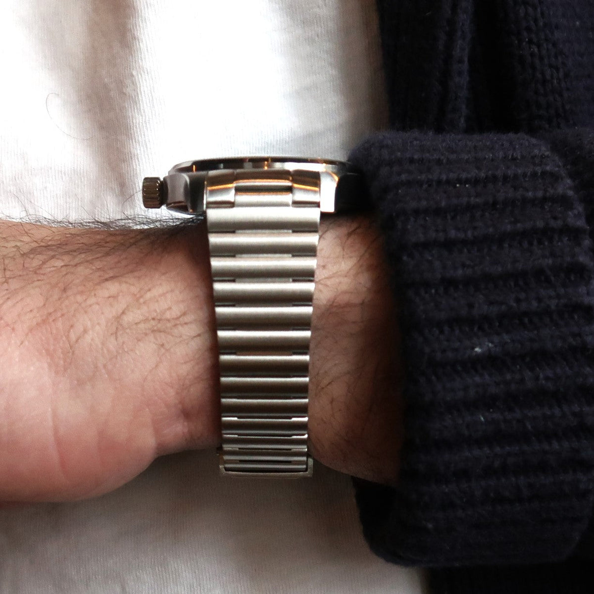 Stainless steel barrel bracelet for IWC Mark XX watch worn on wrist with metal link band