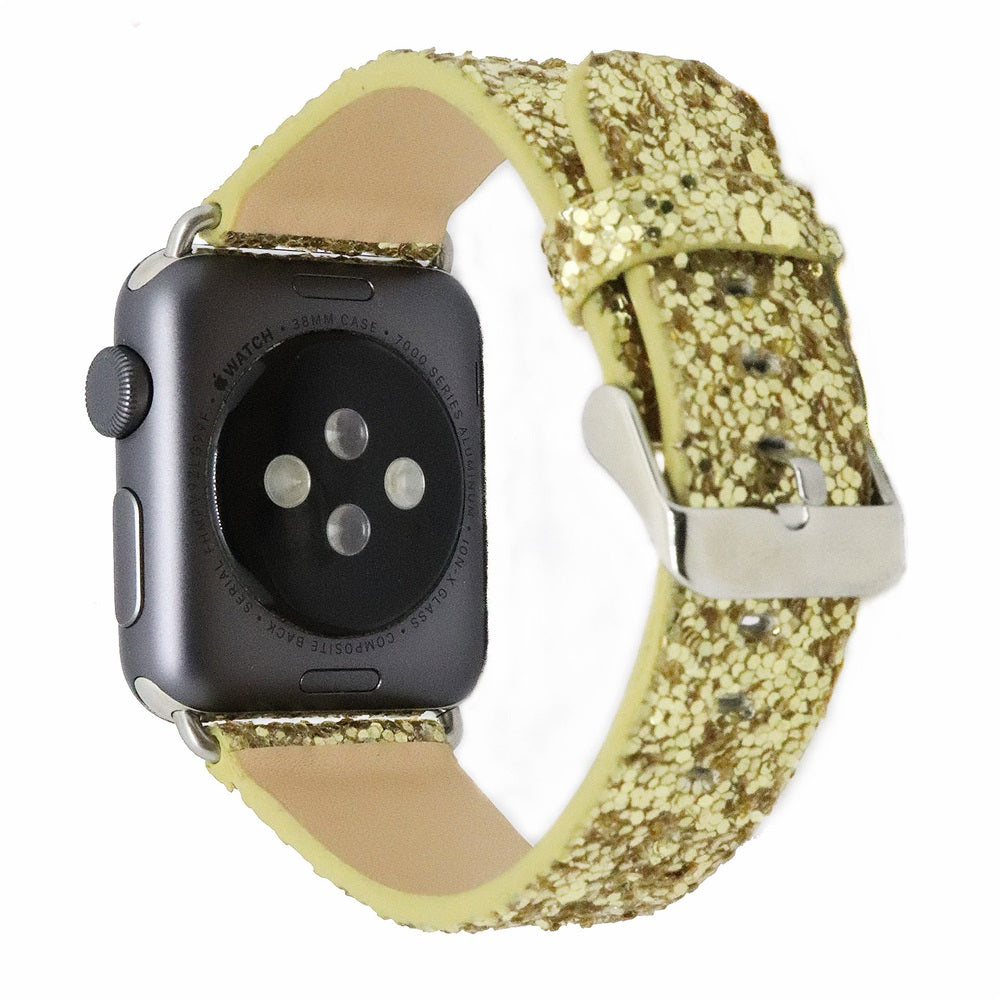 Gold glitter Apple Watch band with leather backing and silver connector hardware on black smartwatch