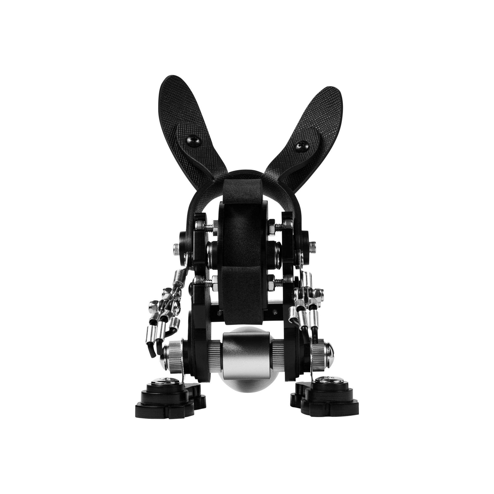Black RoboRabbit robot watch stand with articulated rabbit ears, metal body and mechanical joints for displaying watches