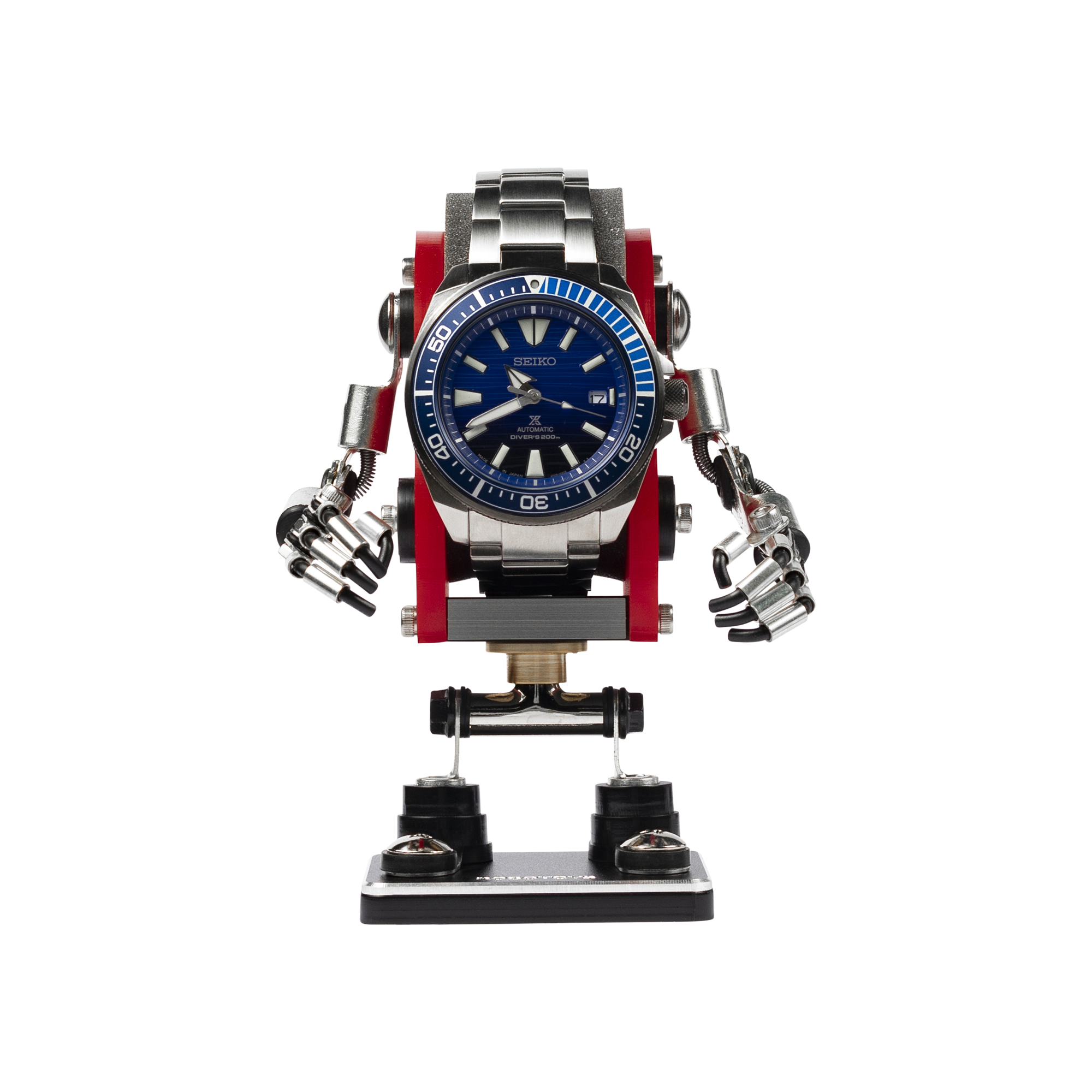 Seiko automatic dive watch mounted on red and black minibot robot figure stand with articulated arms and legs