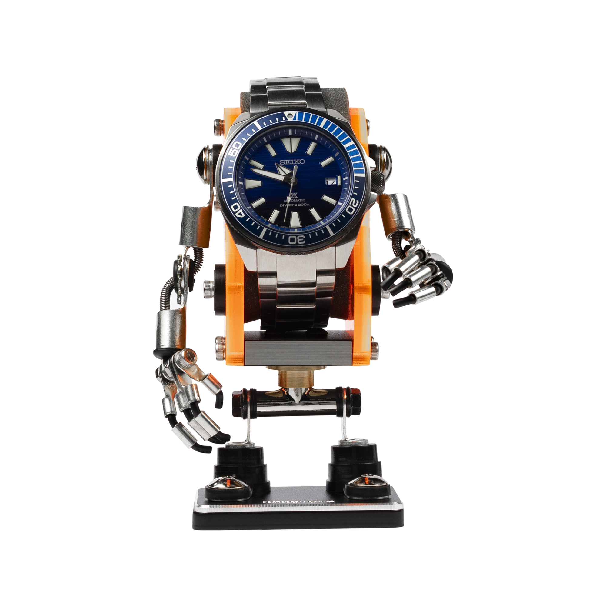 Neon orange and black minibot watch stand holding Seiko dive watch with articulated arms and legs