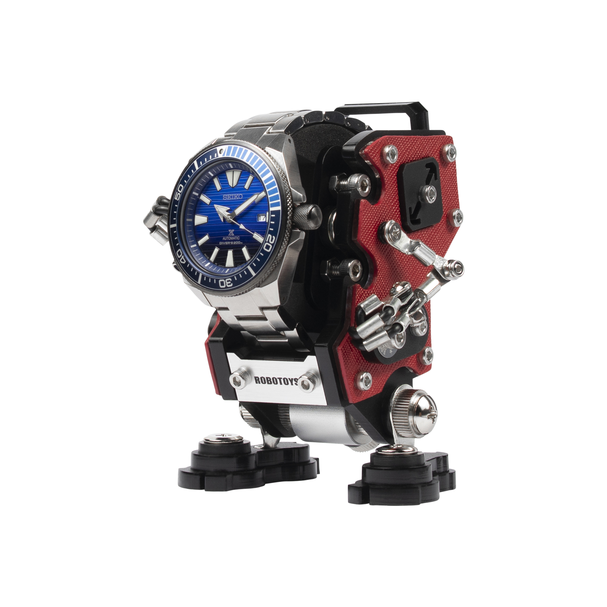 Red NanoBot watch stand displaying Seiko dive watch with black base and mechanical robot design
