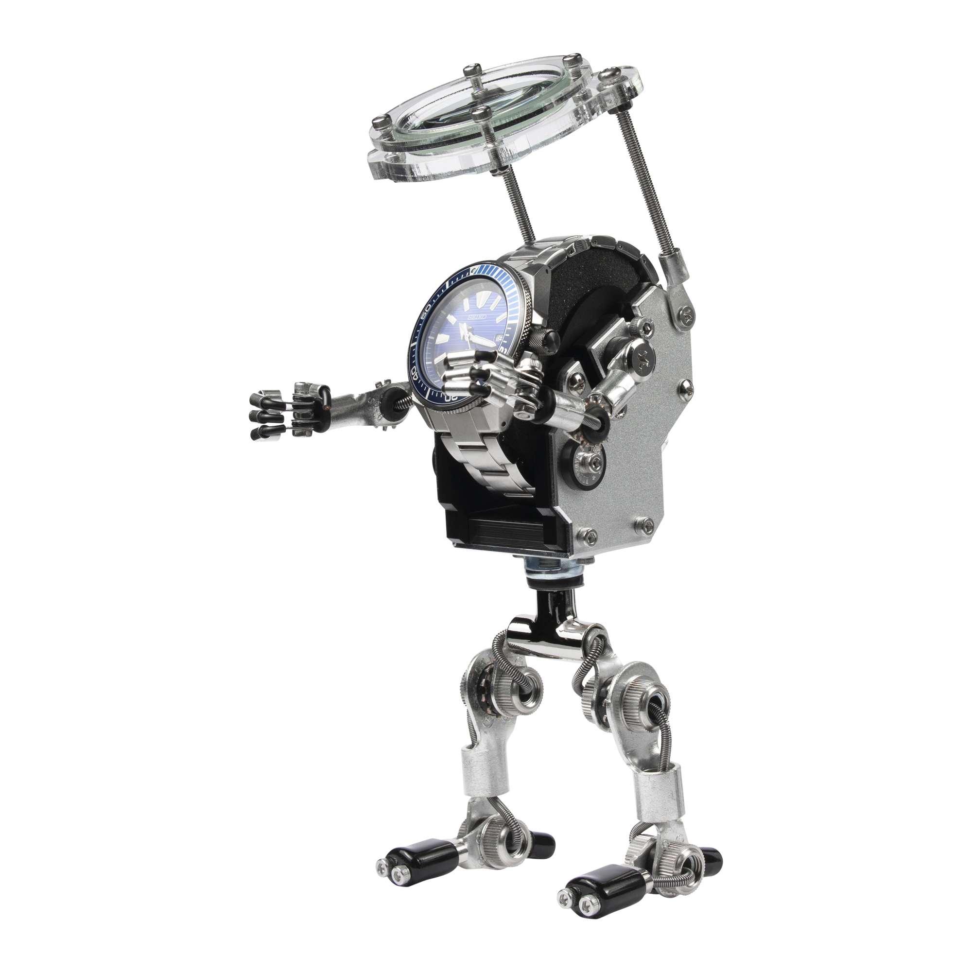 Mechanical robot watch stand with magnifying glass, silver metal body, black accents, articulated limbs, blue dial timepiece