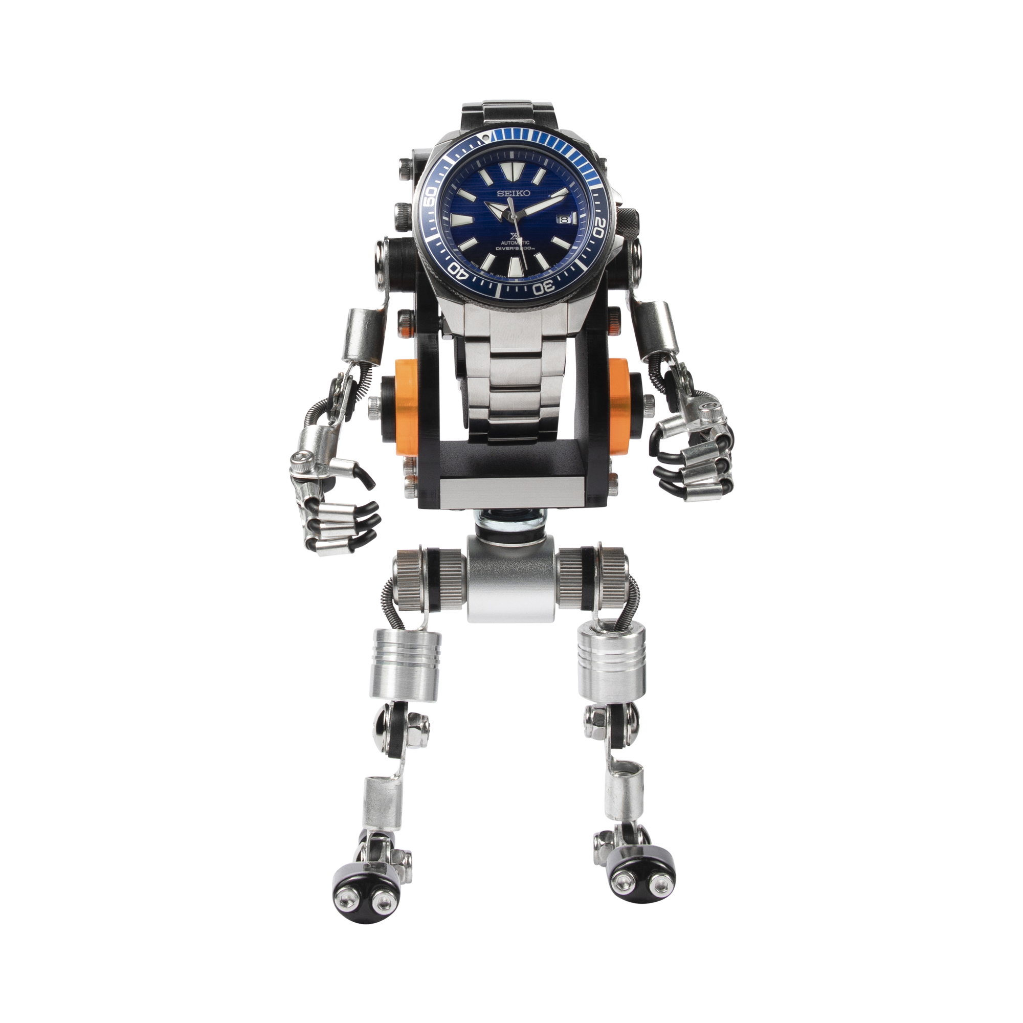 Seiko dive watch displayed on articulated silver robot stand with orange accents and poseable mechanical arms and legs