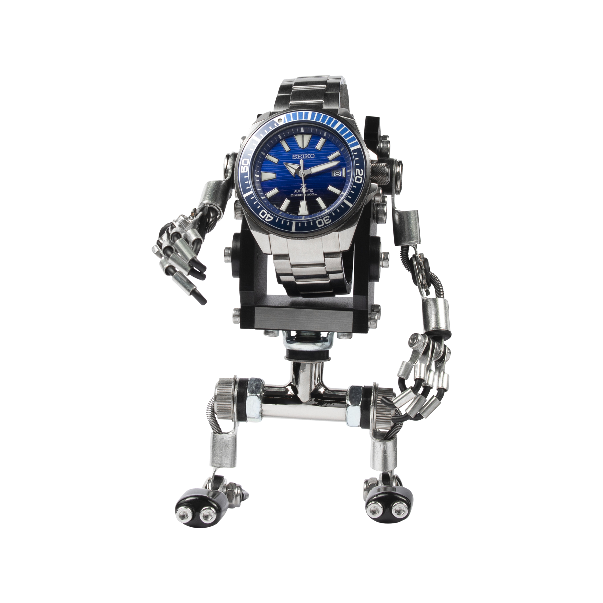 Seiko automatic dive watch with blue dial mounted on articulated metal robot stand with movable arms and legs