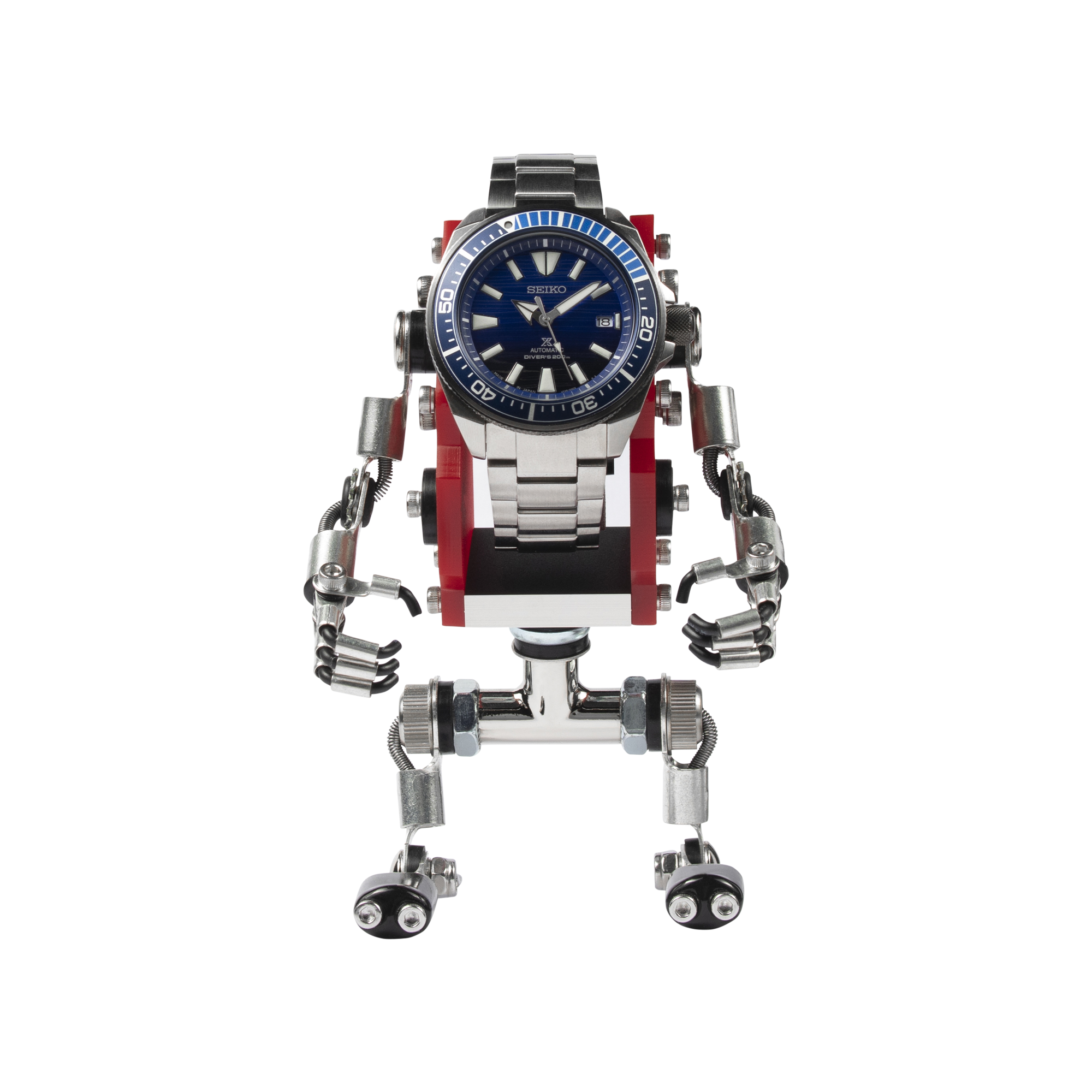 Seiko dive watch mounted on red and silver mechanical robot stand with articulated arms and legs