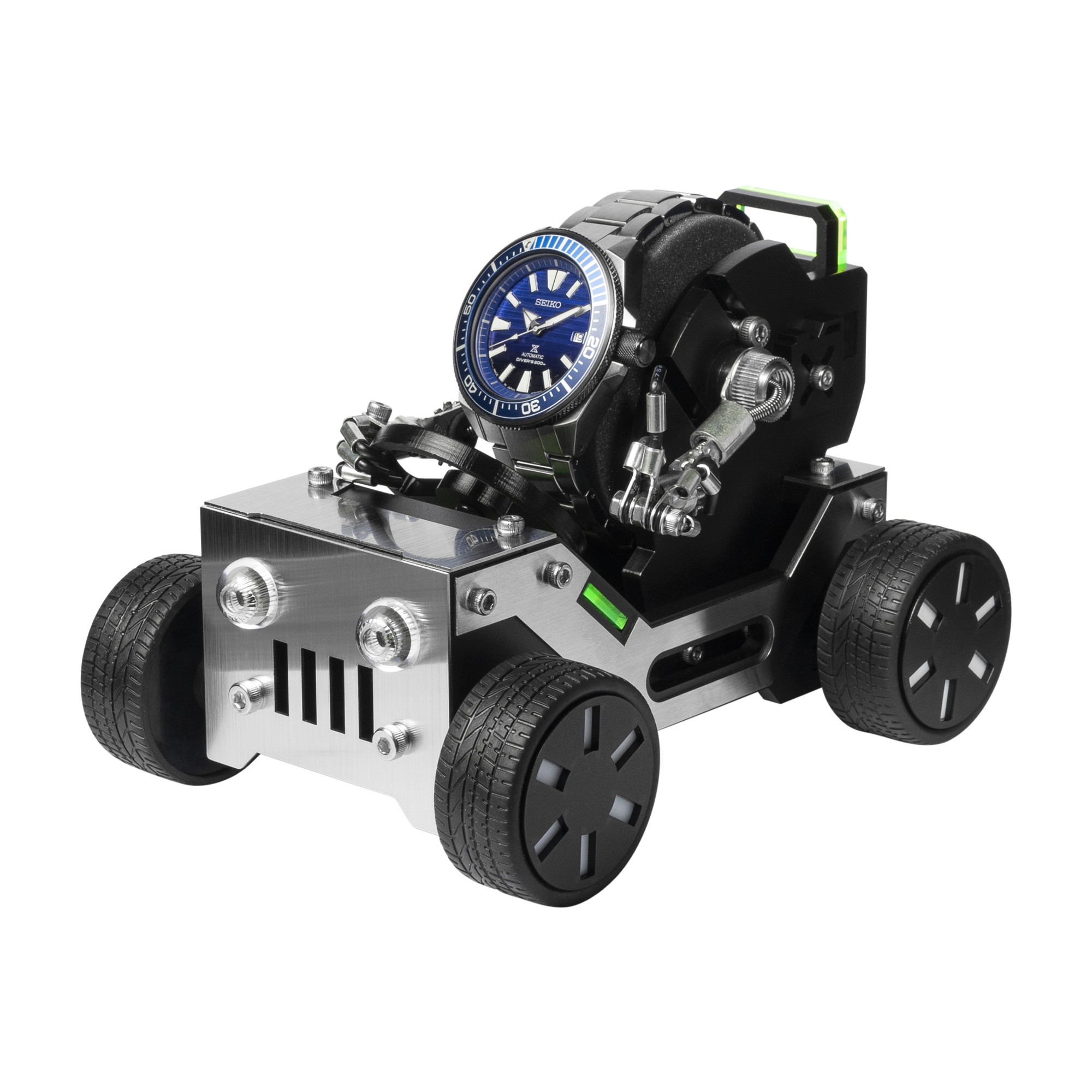 Stainless steel offroad car watch stand with blue dive watch, black tires, and green accents holding timepiece