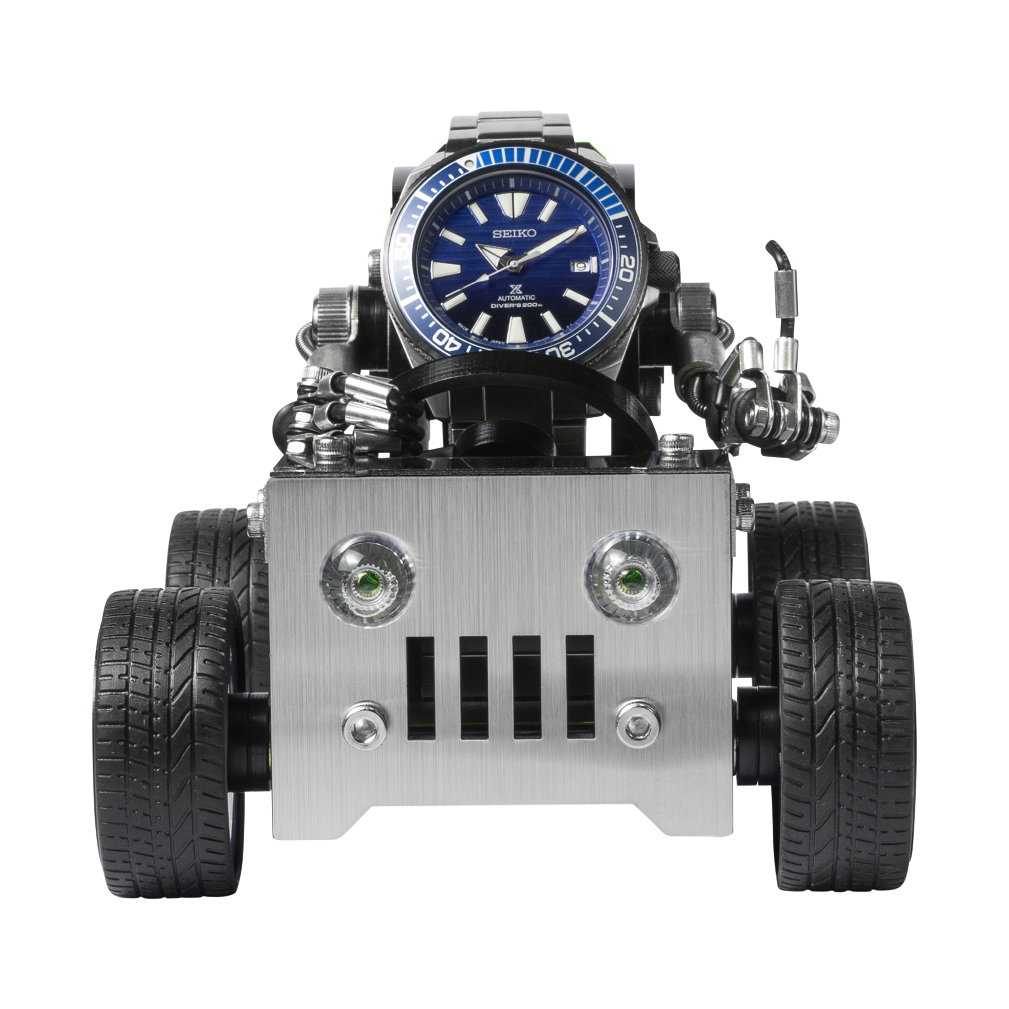 Seiko automatic blue dial watch mounted on silver metal off-road robot vehicle stand with black wheels and articulated arms