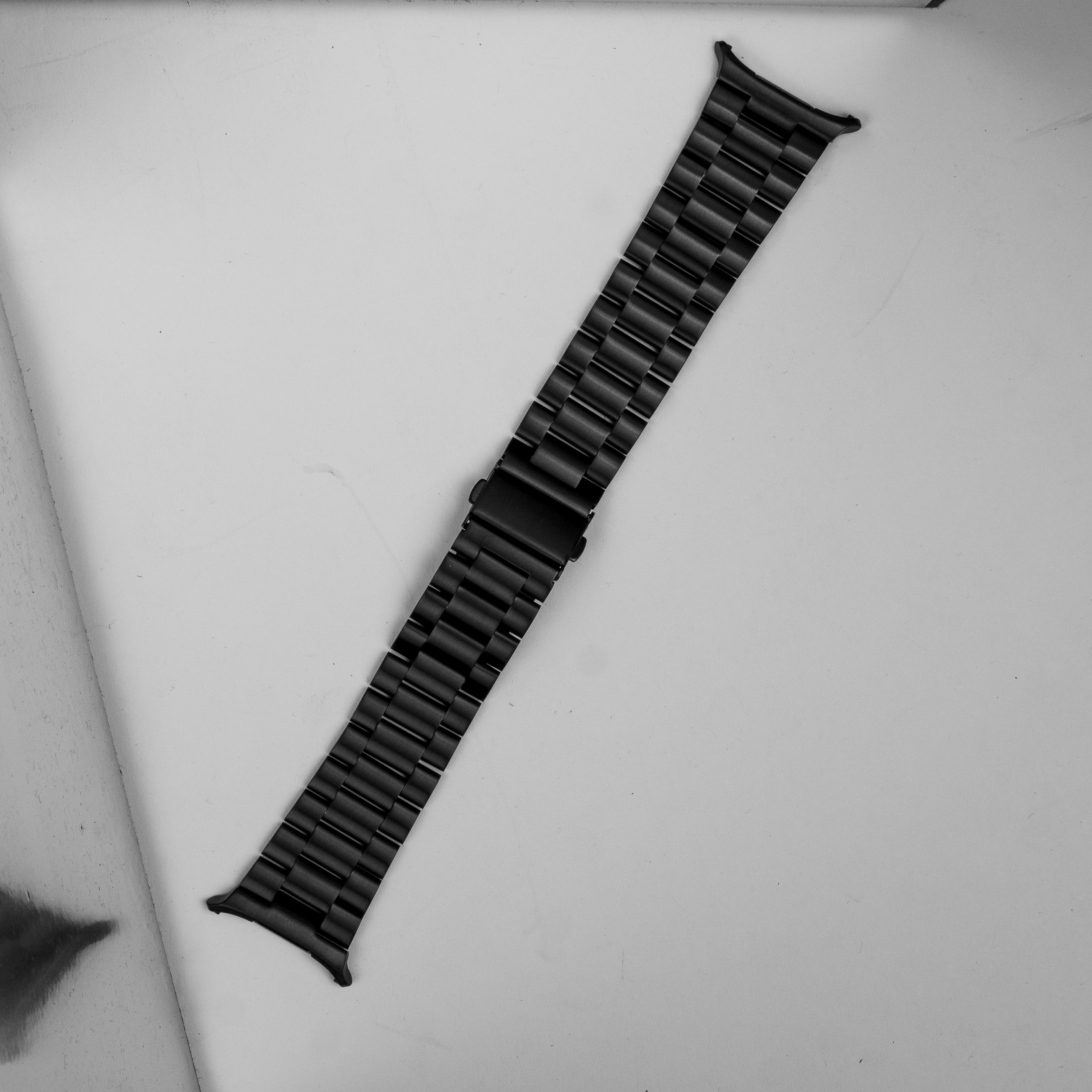 Black stainless steel bracelet band for Galaxy Watch Ultra with link-style design and curved connector