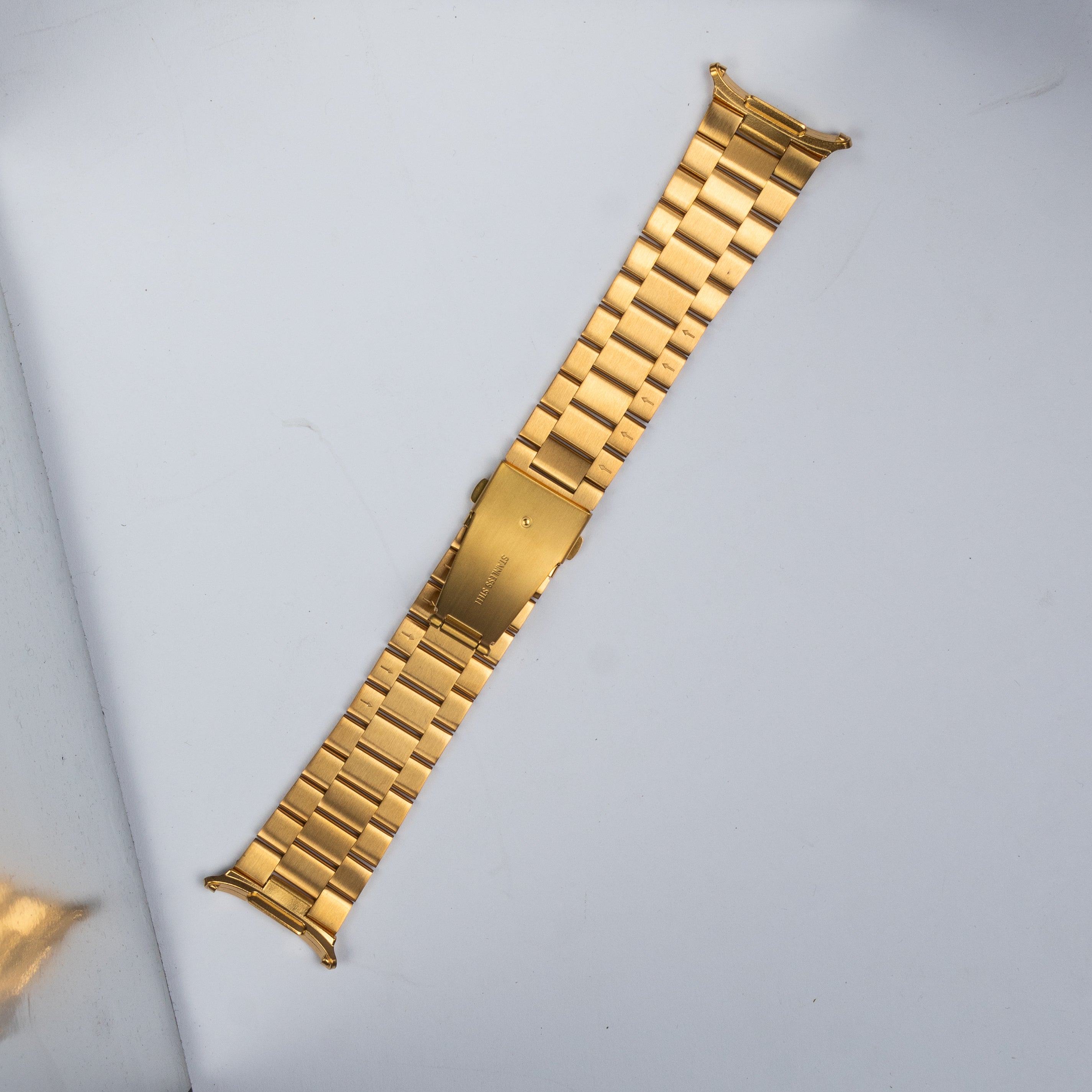 Gold stainless steel bracelet band for Galaxy Watch Ultra with solid link construction and secure clasp closure