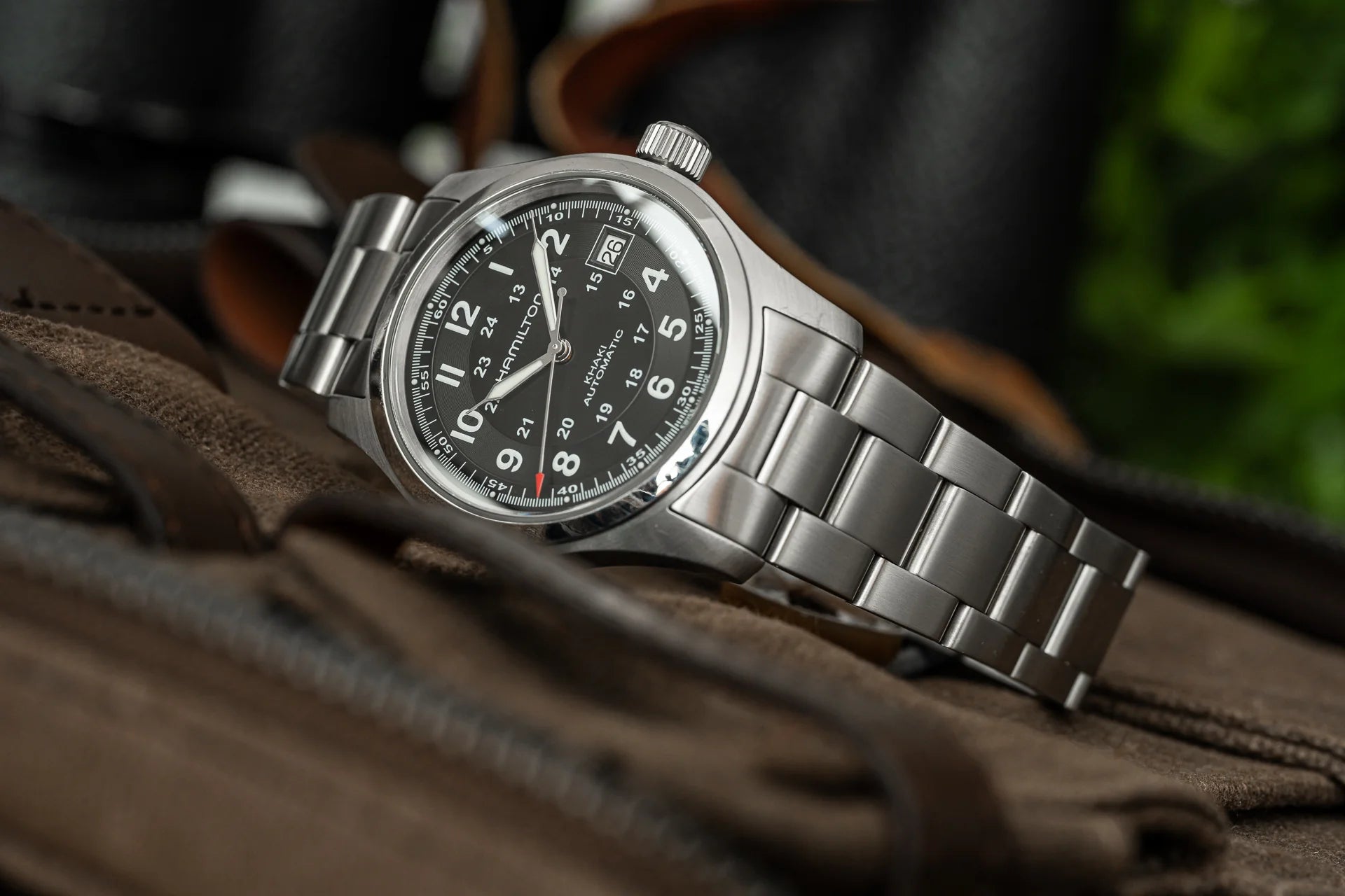Hamilton Field Auto stainless steel watch with black dial and date window on leather strap