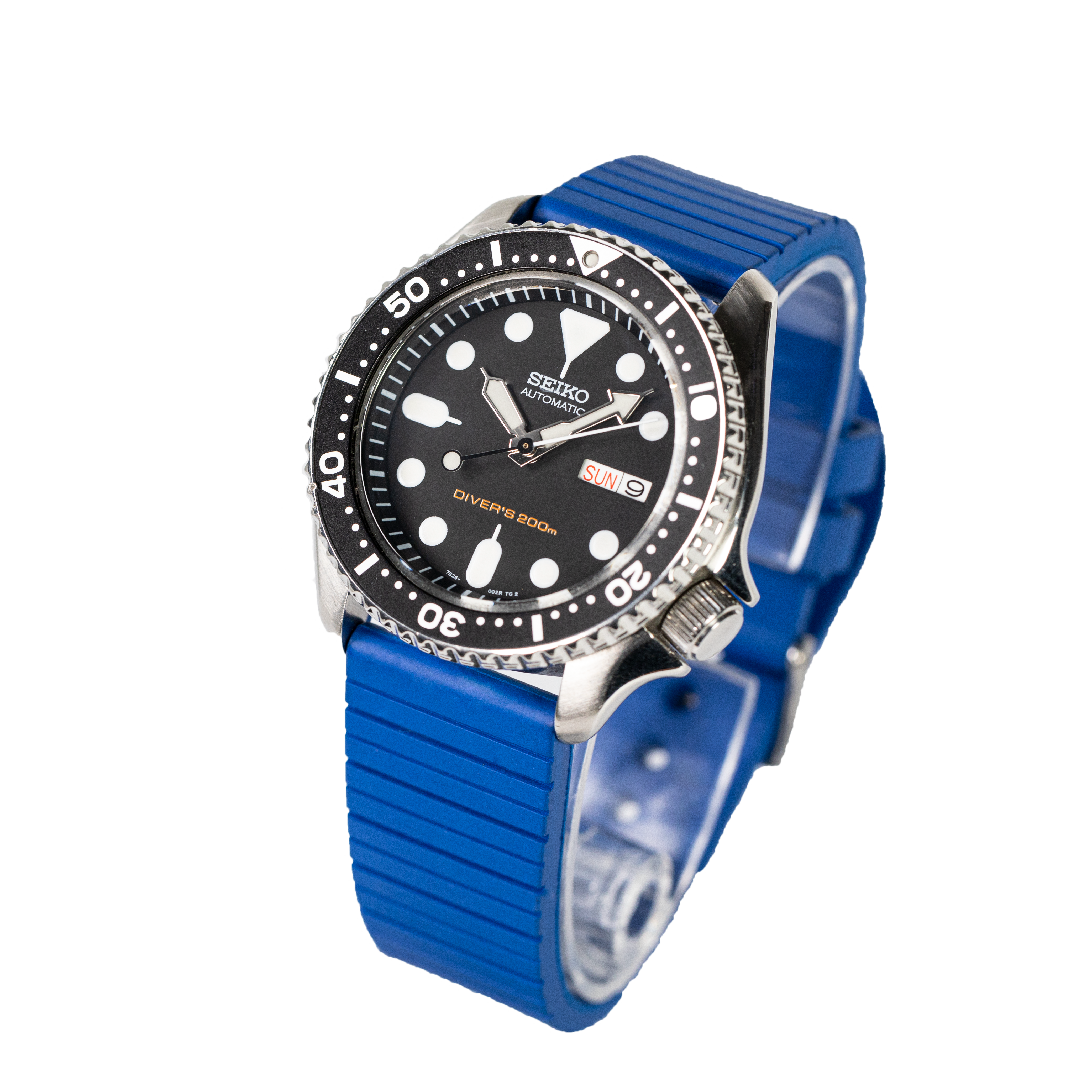 Seiko automatic diver's watch with black dial, white dot markers, rotating bezel, and blue rubber strap, 200m water resistant