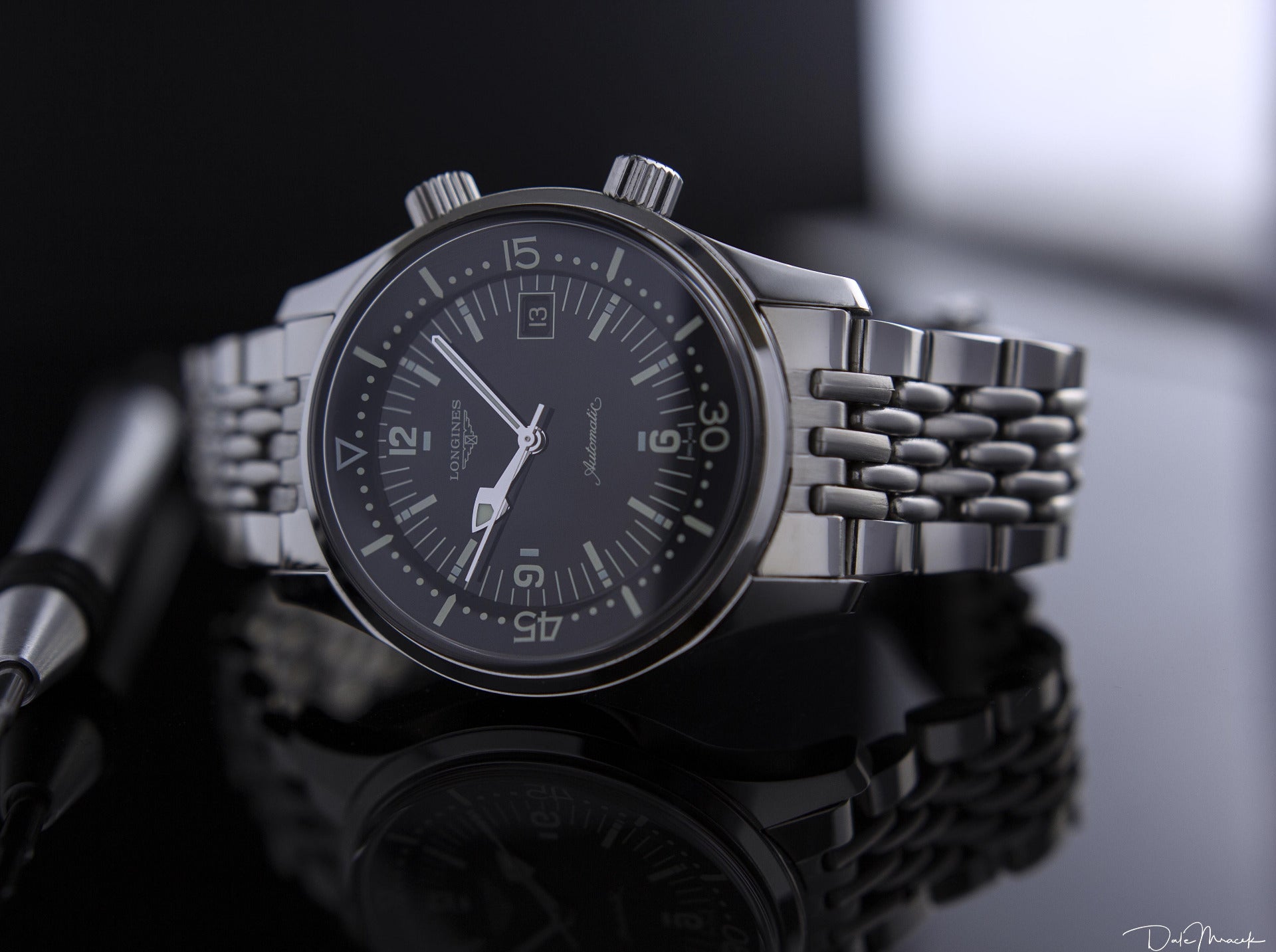 Longines Legend automatic chronograph watch with black dial, stainless steel bracelet, date window and Arabic numerals