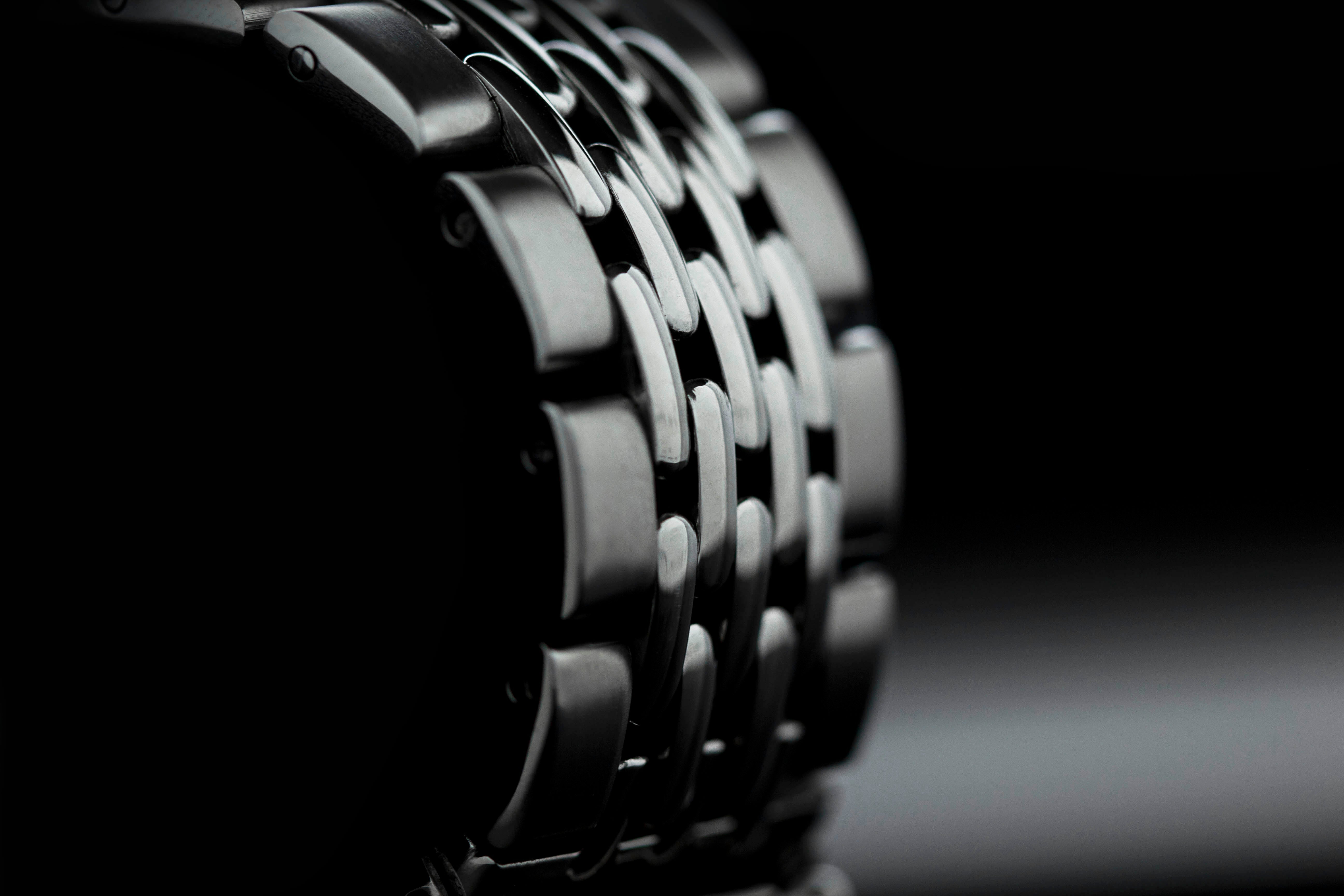 Stainless steel beads of rice bracelet on Seiko Samurai watch showcasing detailed link design in black and white close-up