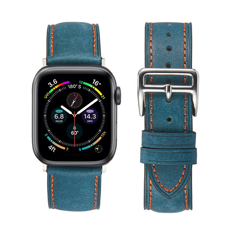 Smartwatch with square black display showing colorful dashboard metrics, paired with teal leather band featuring orange stitching and metal buckle