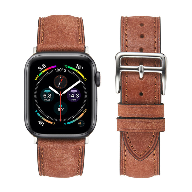 Smartwatch with square black case and colorful digital compass dial, paired with cognac brown leather band featuring silver buckle