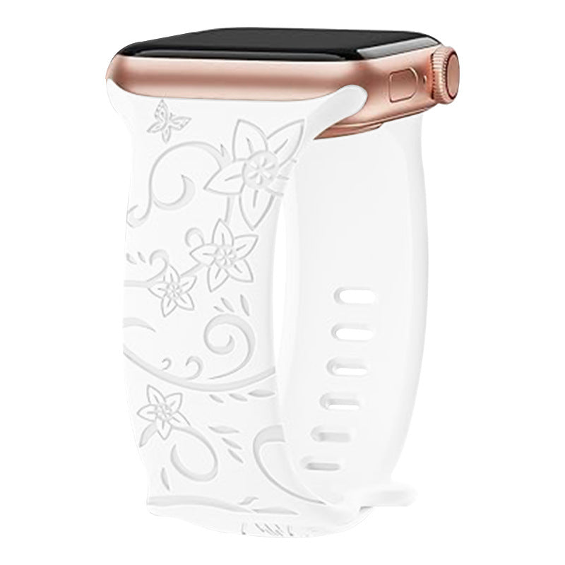 White floral silicone Apple Watch band with rose gold aluminum case and digital display