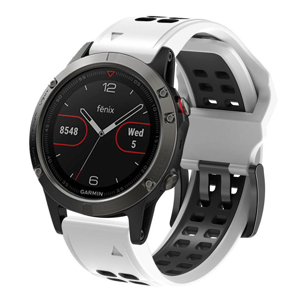 Garmin Fenix smartwatch with white and black QuickFit silicone sports band showing date and heart rate display